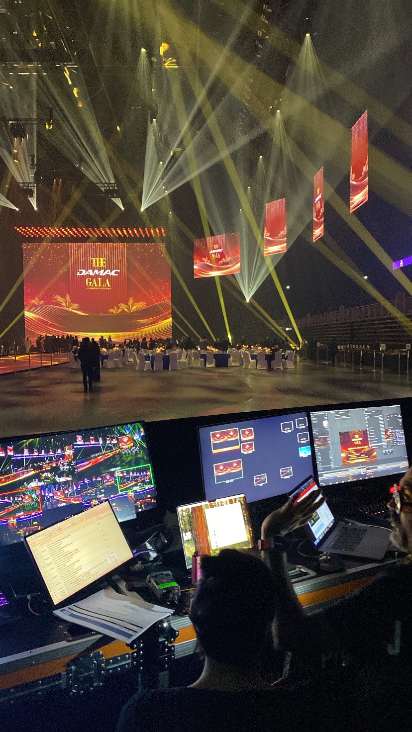 Large stage show with dramatic lighting and live performance setup for DAMAC Riverside launch in Dubai