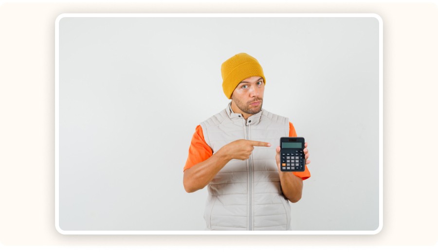 Man holding a calculator