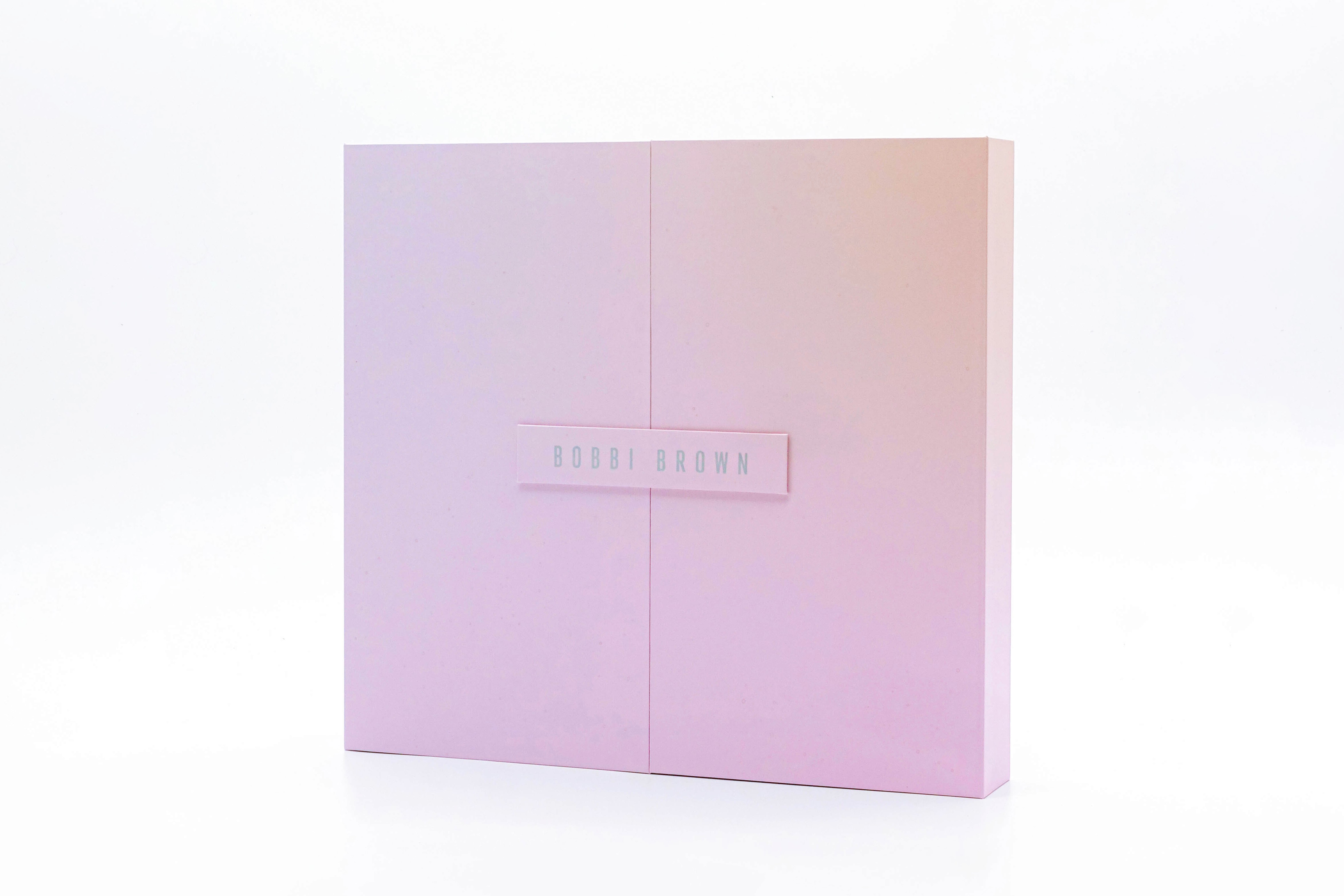 Open book with sunlight and shadows highlighting editorial typography design