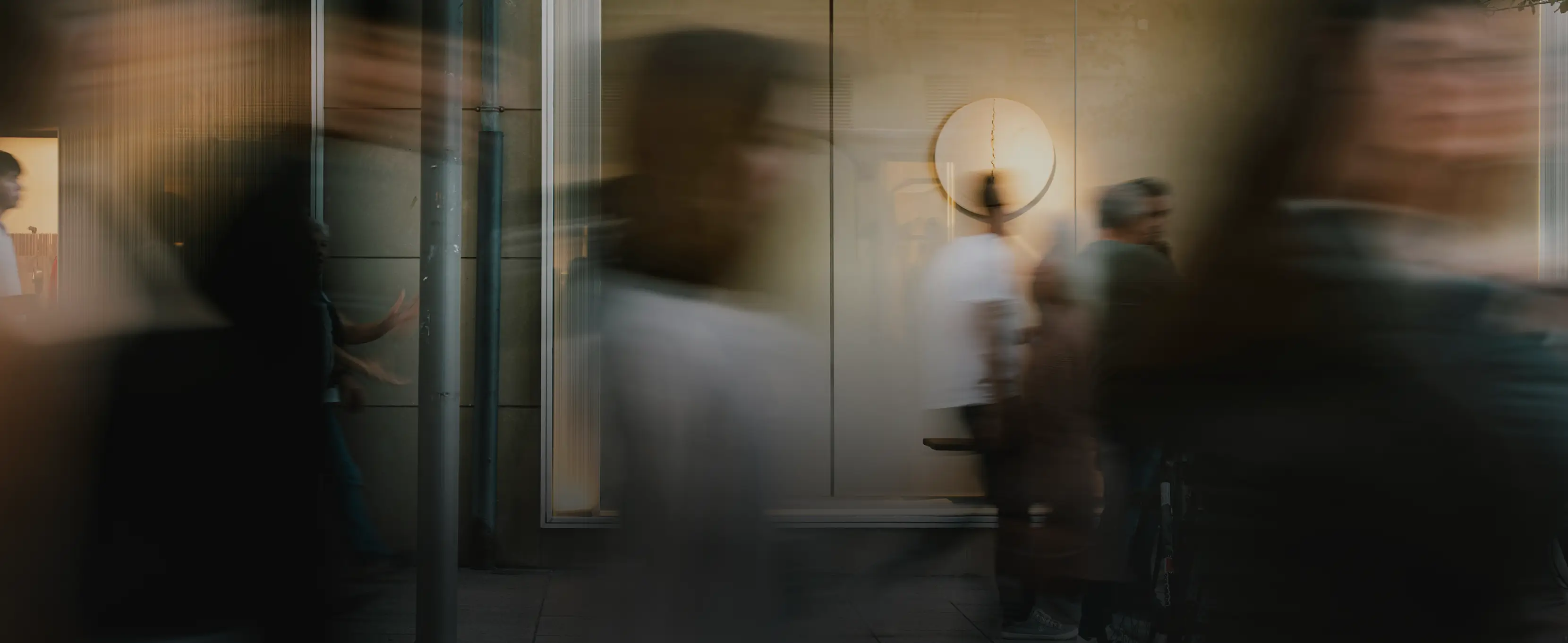 A blurry effect image of people walking through a room