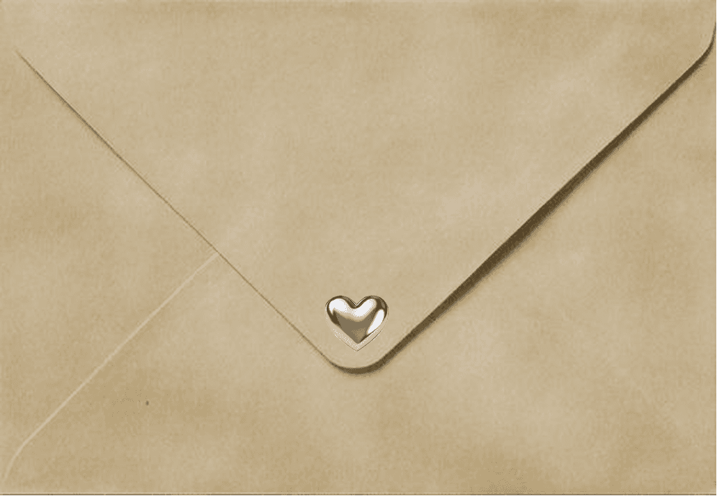 A beige envelope is sealed with a small, elegant chrome heart-shaped clasp, adding a touch of sophistication and warmth.