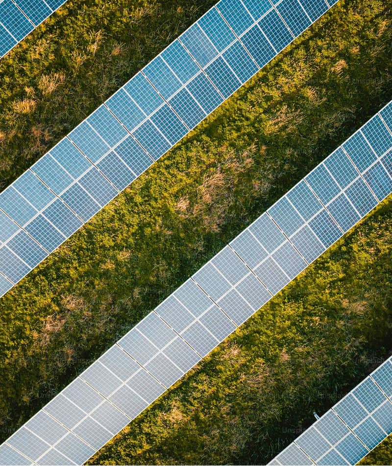 Aerial view of a solar panel array in a grassy field, Powerhouse Renewables Group Australia