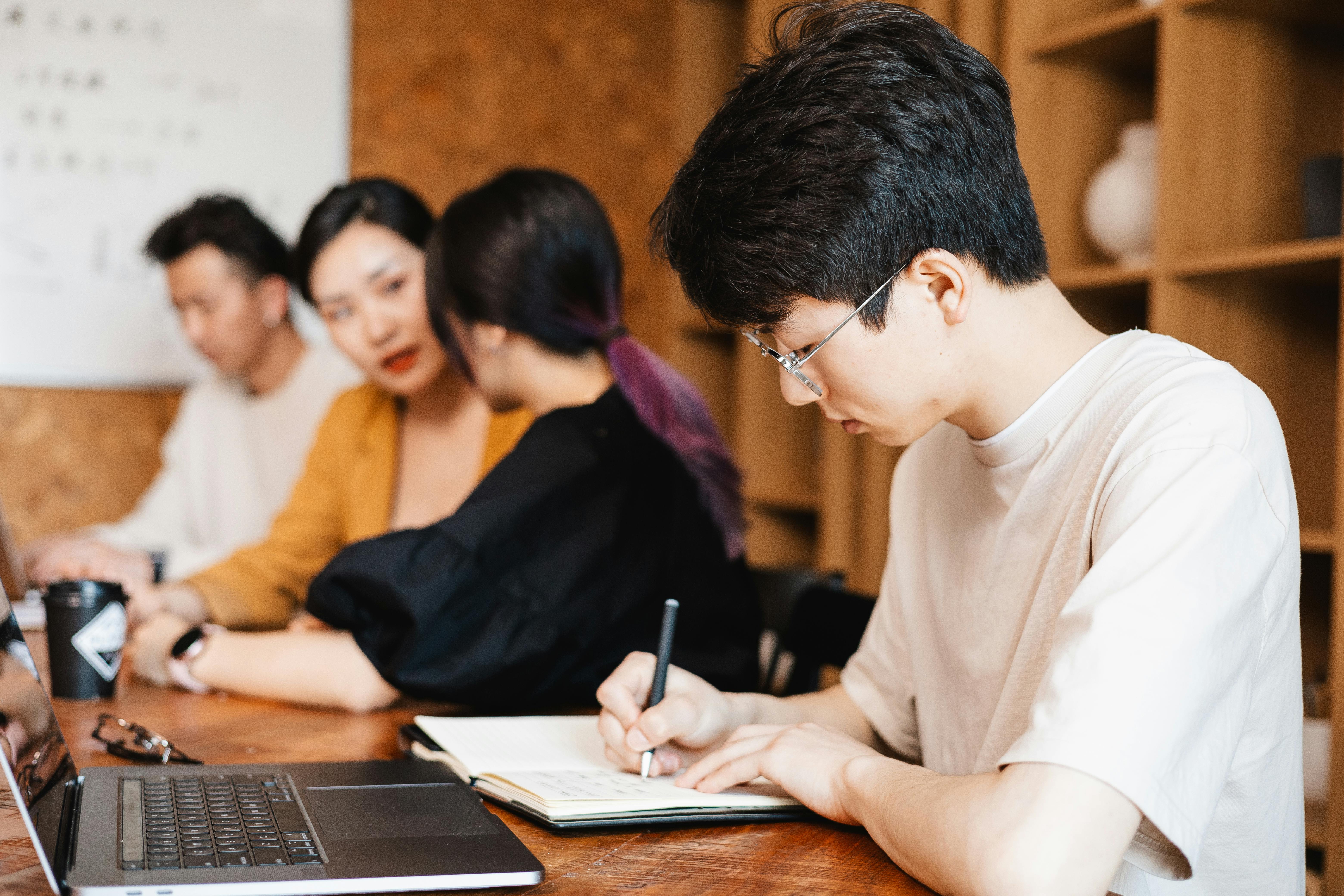 College students preparing project materials for ITP application