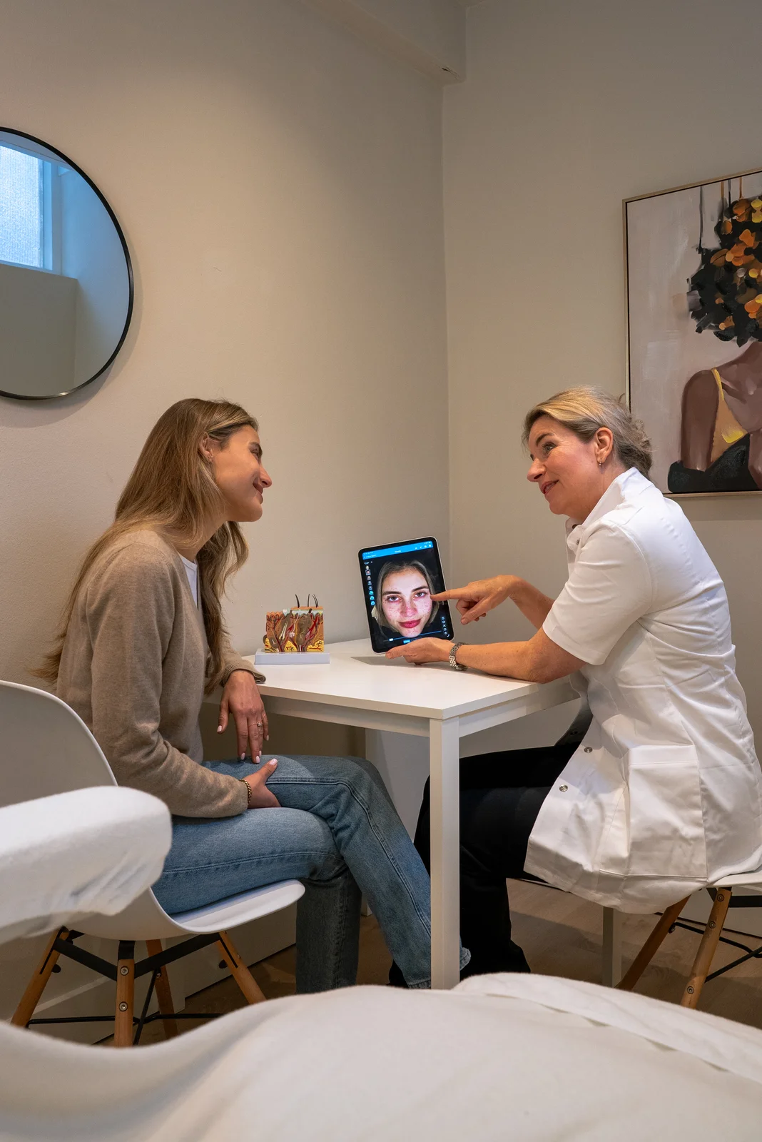 Skin therapist discussing a personal skin analysis
