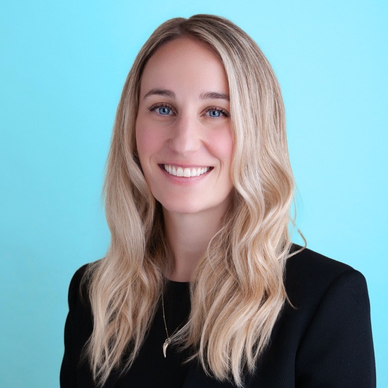 a man in a blue suit posing for a picture