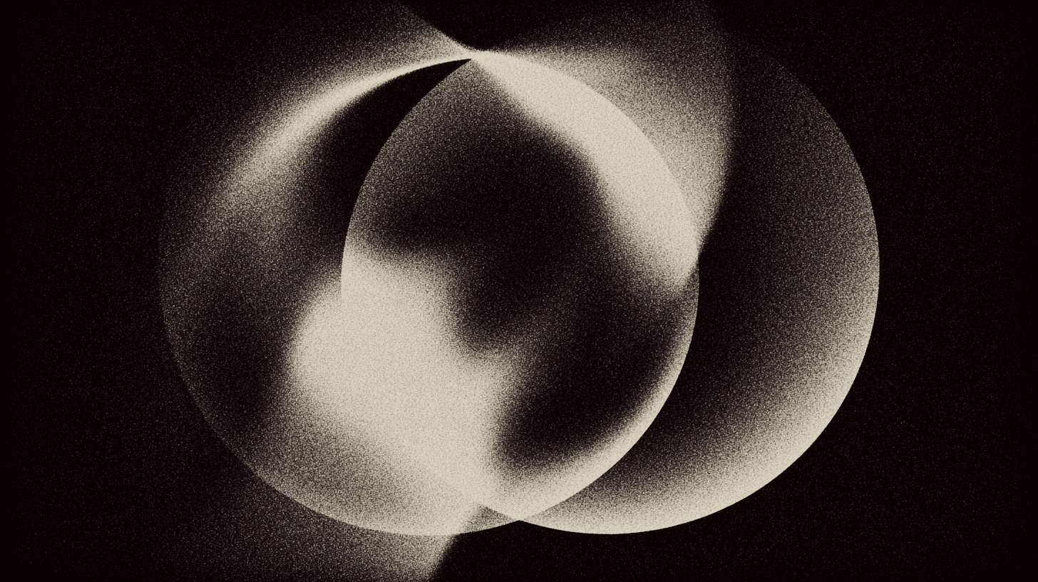 Etheric, blurred and grainy circular shapes on a black bacground