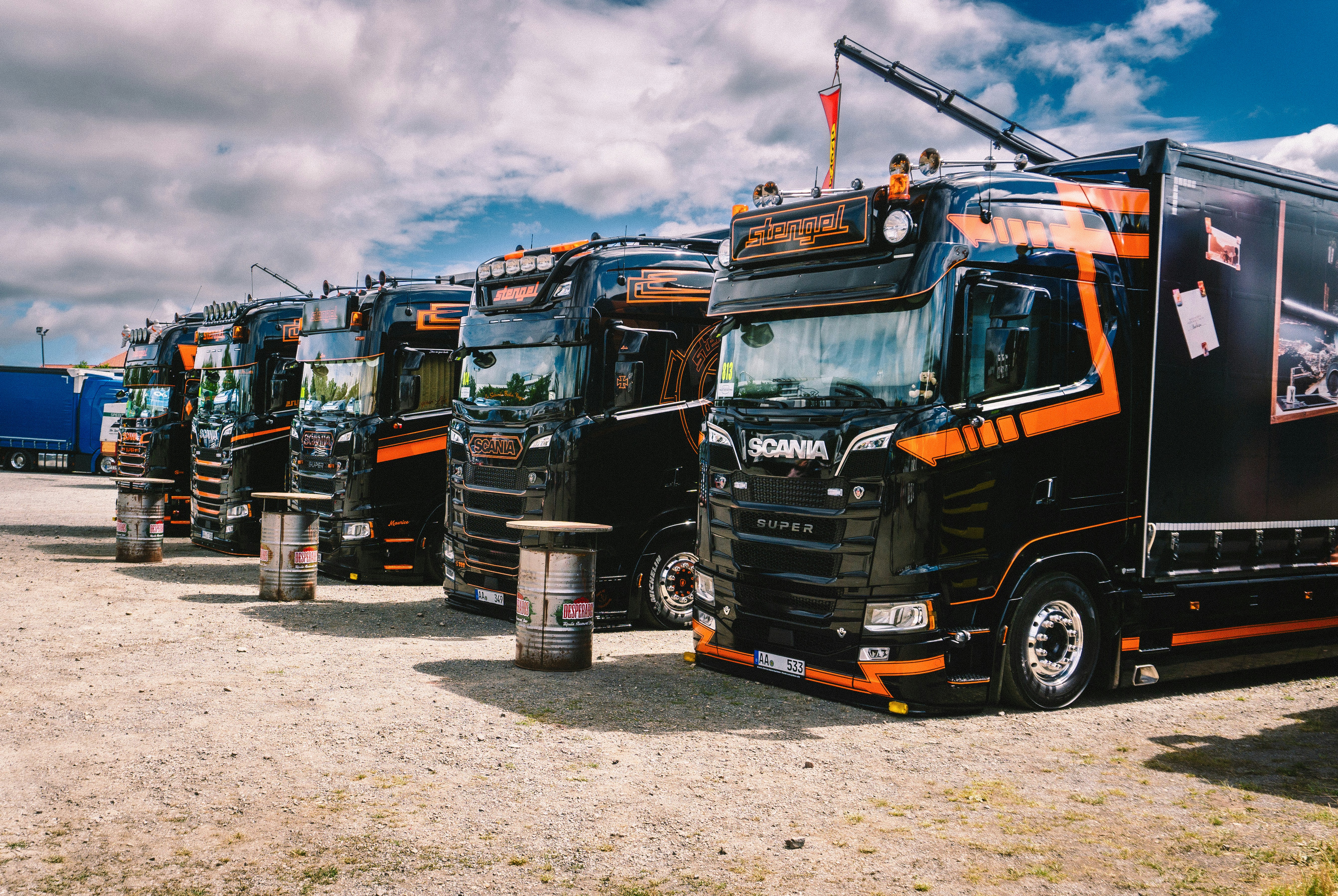 A row of semi trucks parked next to each other