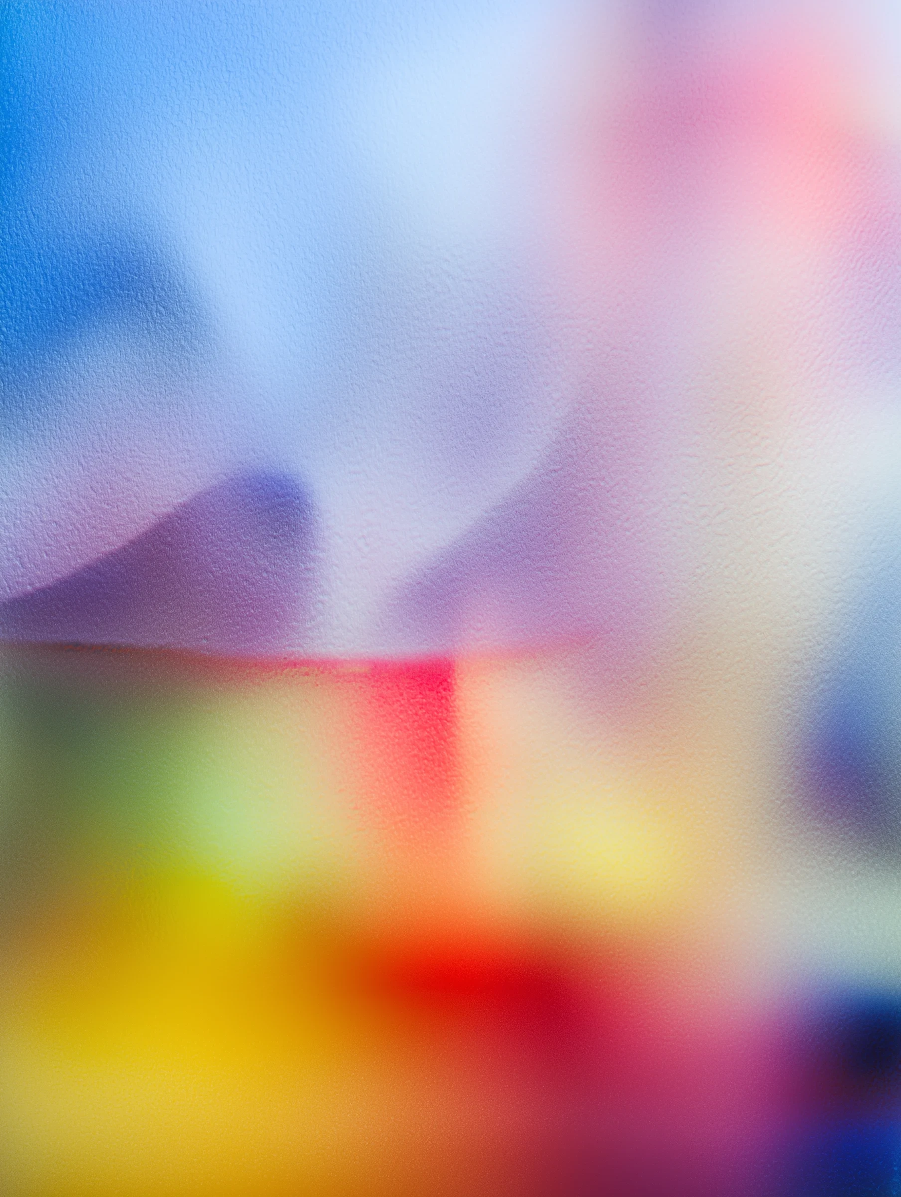 Lumen Table brand visual: soft-focus gradient shifting from blue and lilac into bands of yellow and red