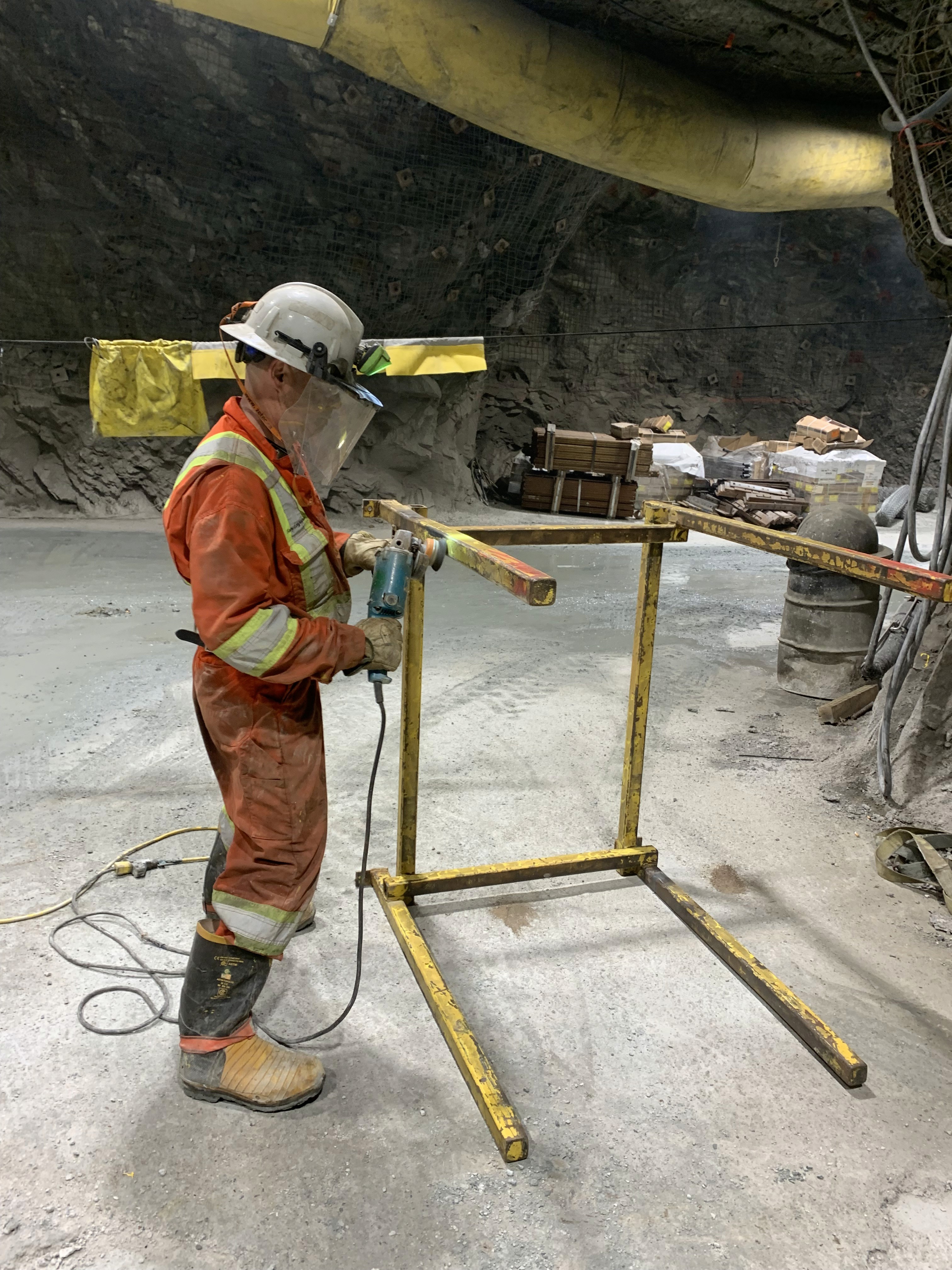a view of a large open pit in the middle of nowhere