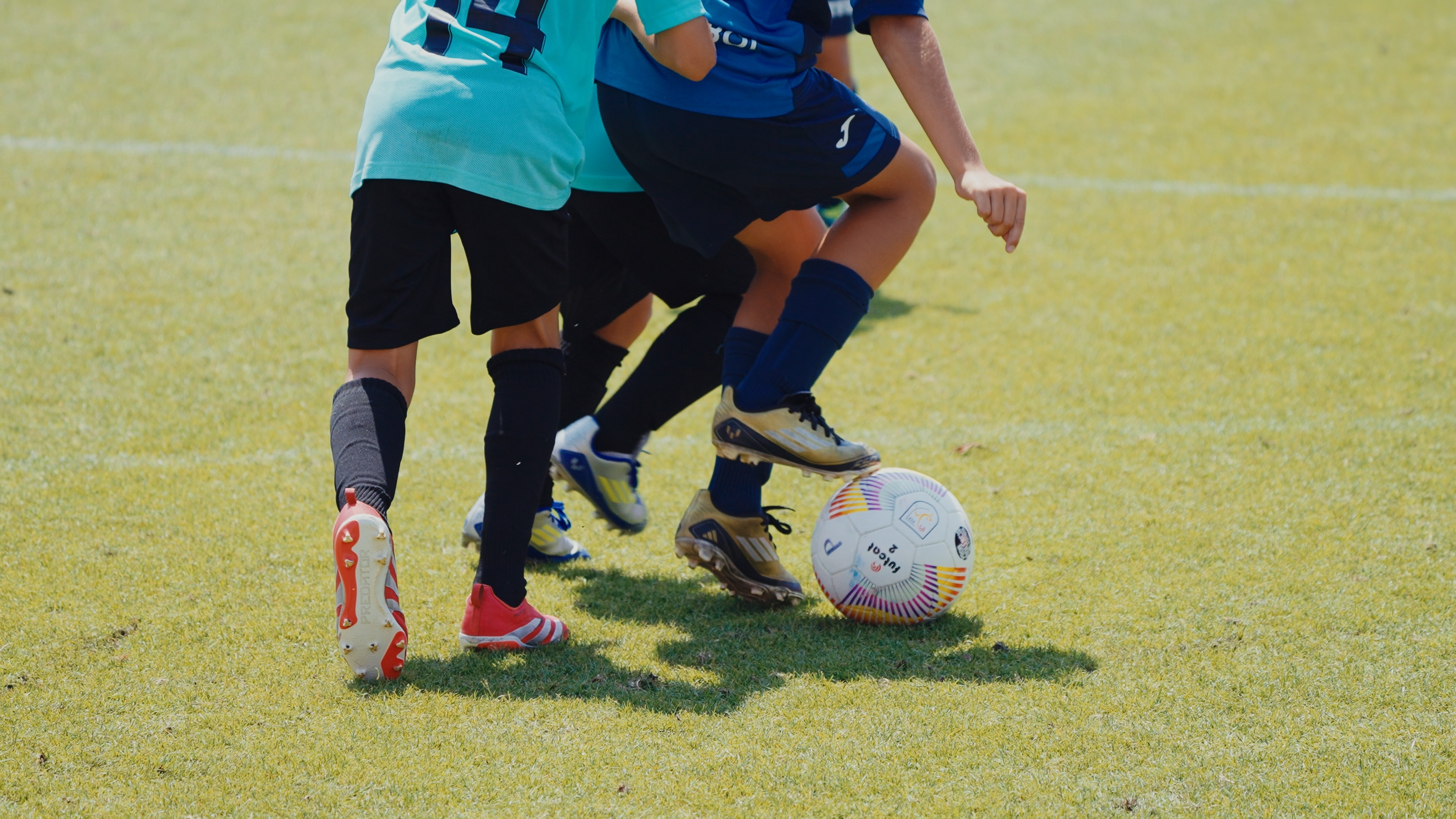 A woman with her eyes closed, wearing a helmet, appears to be in a moment of concentration or relaxation.