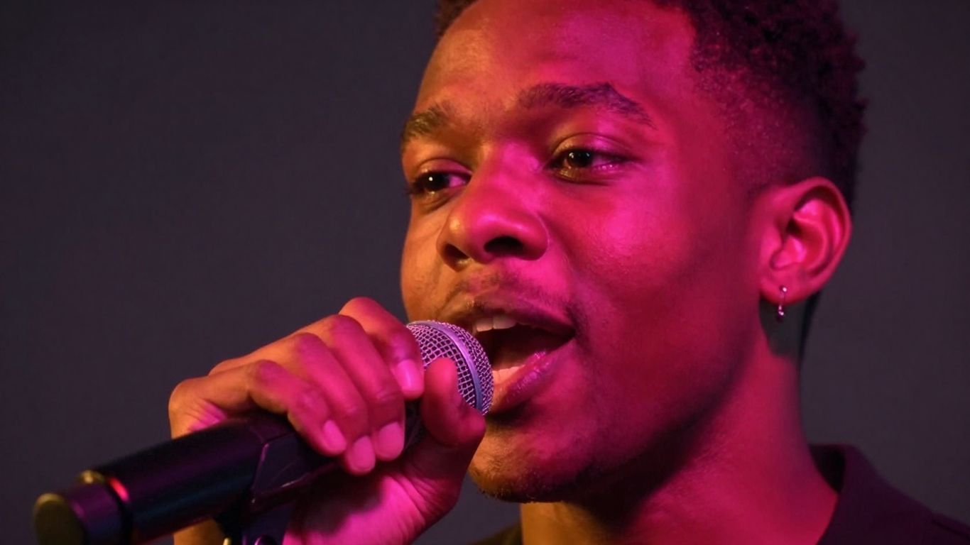 Person speaking into a microphone with vibrant colors.