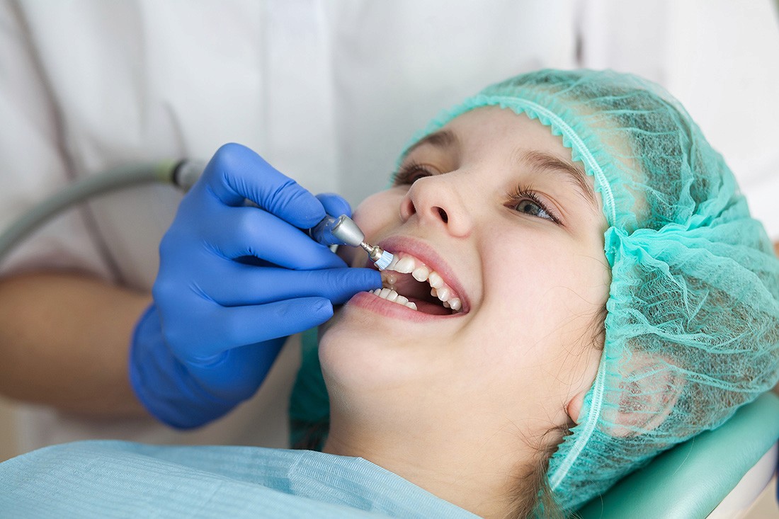 Child getting teeth polished by Dr. Rai, Dentist in Arlington at Shirlington Pediatric Dentistry.