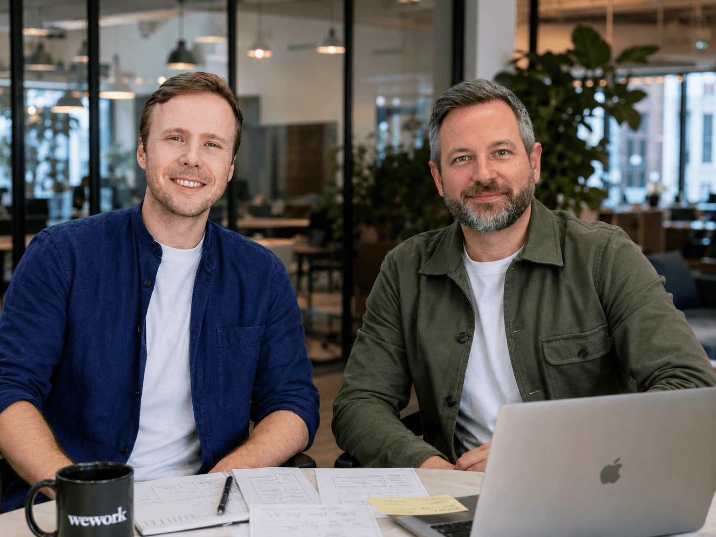 Team of two people sitting together in a modern office