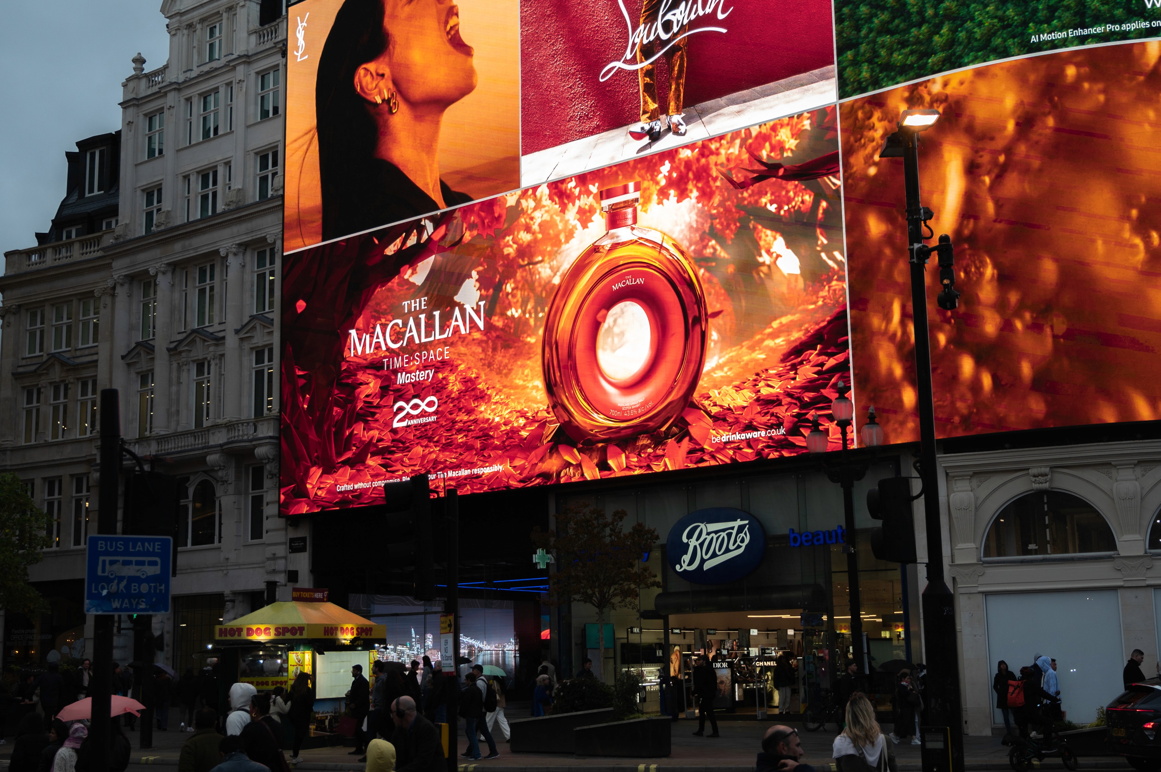 Streetside billboard with flyposters of the Batch.Works brand and illustrations