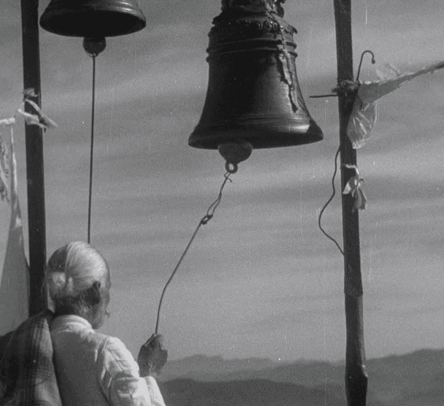 a group of women standing on top of a sandy beach