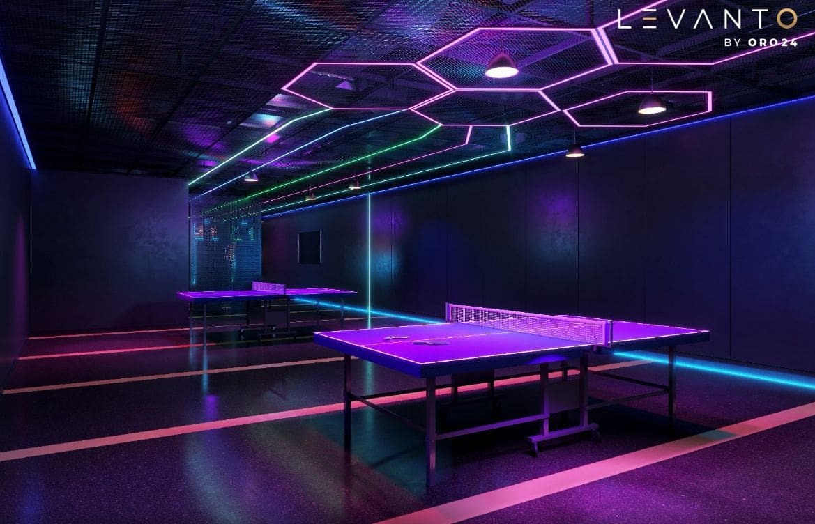A ping pong table illuminated by neon lights in a dark room, showcasing the Levanto by ORO24 design.