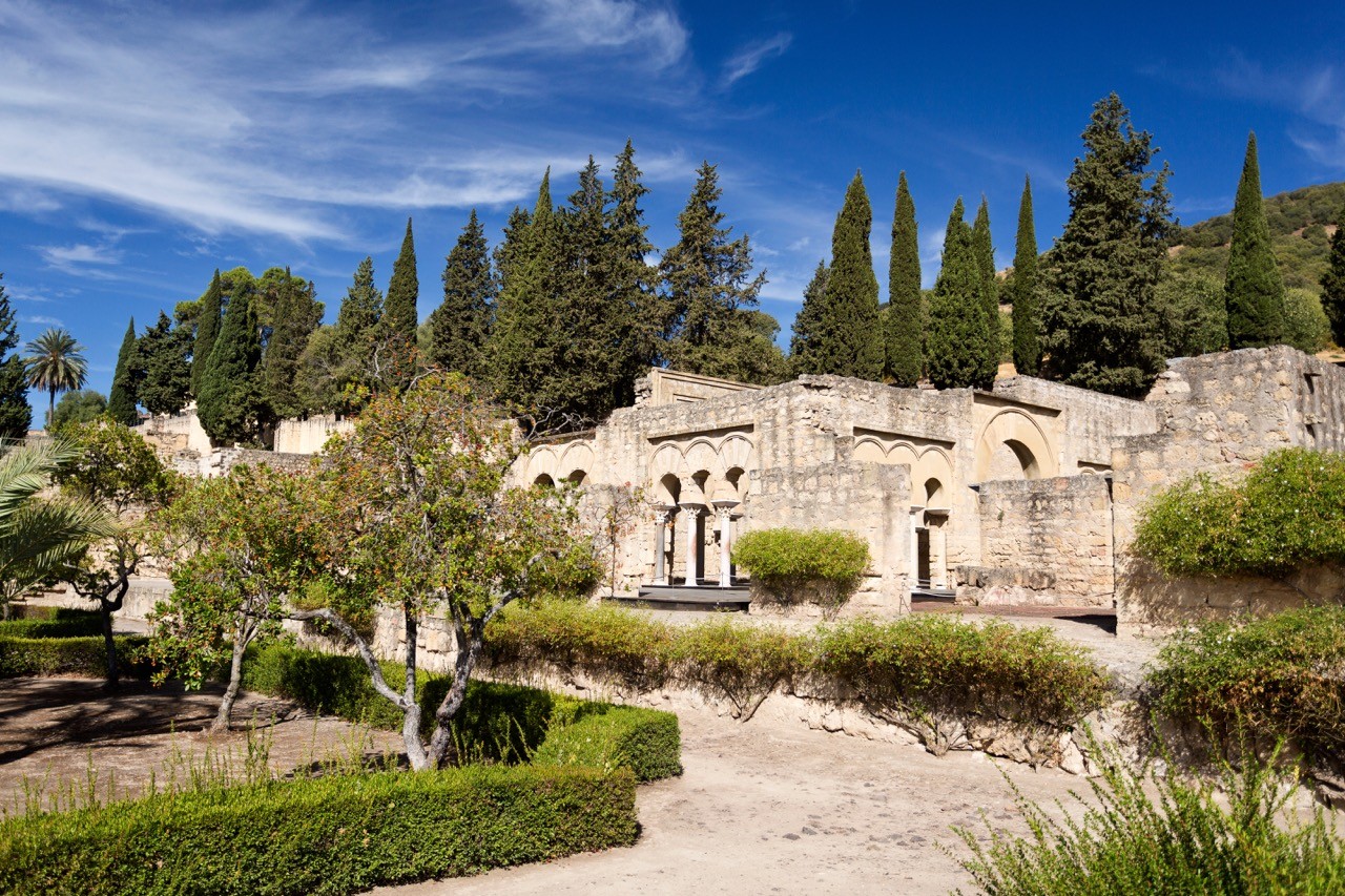 Medina Azahara ruins with cypress trees in High Garden, Cordoba.