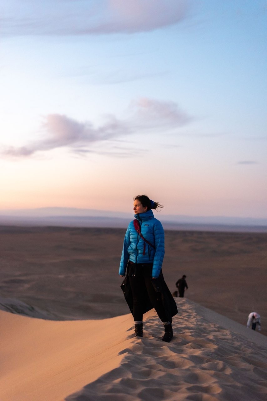 a blurry photo of a person standing in front of a wall
