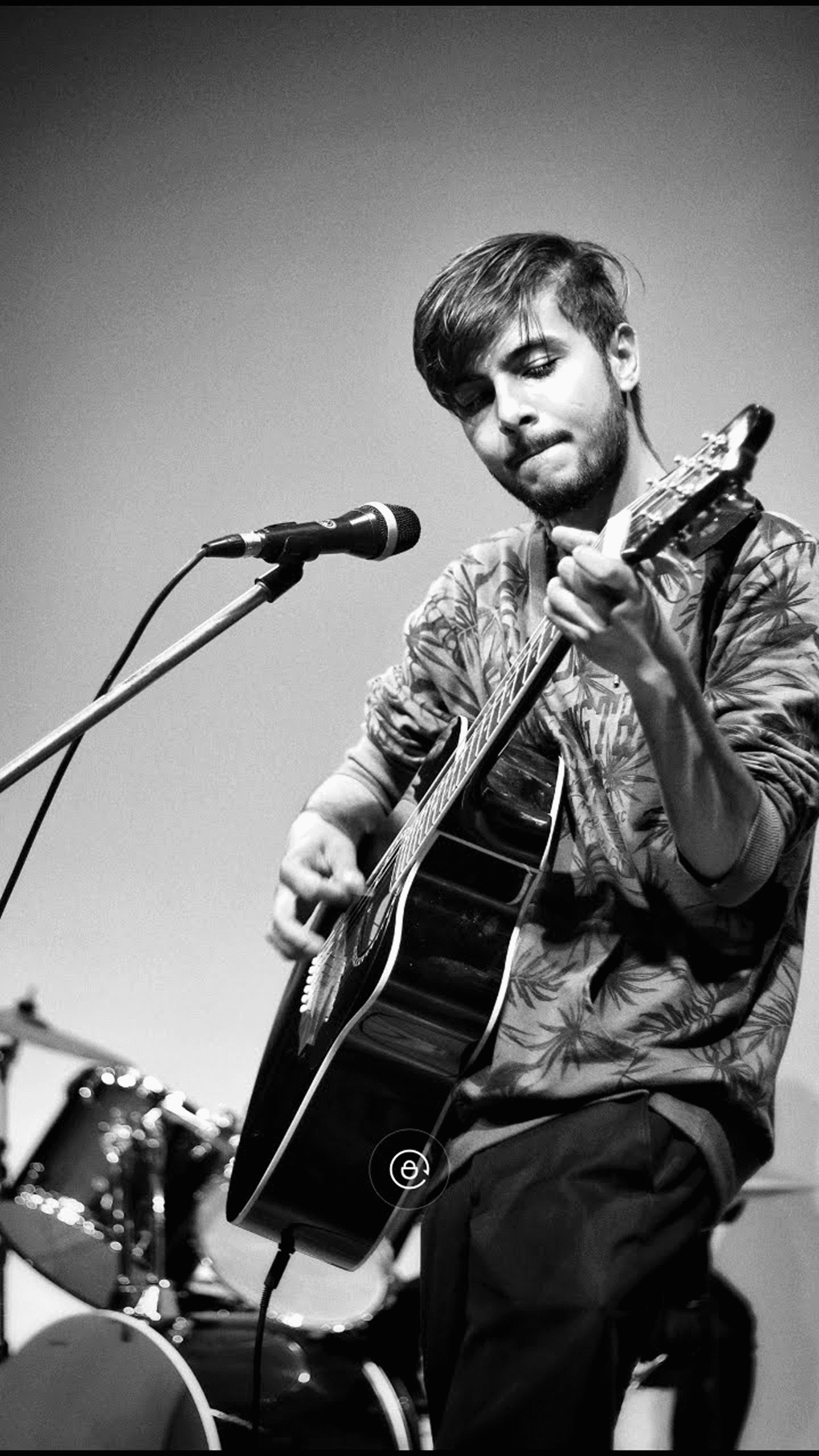 a man singing into a microphone