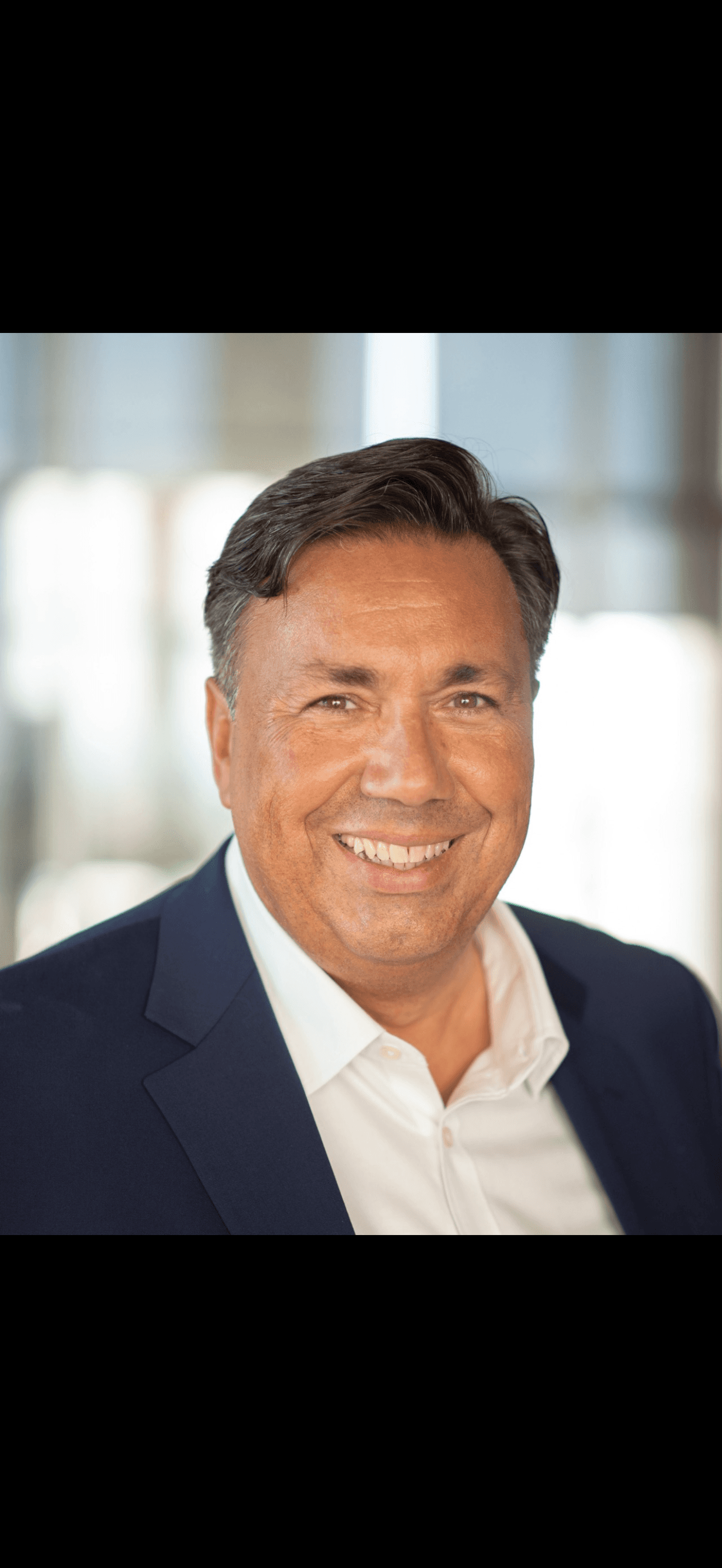 woman in white crew neck shirt smiling