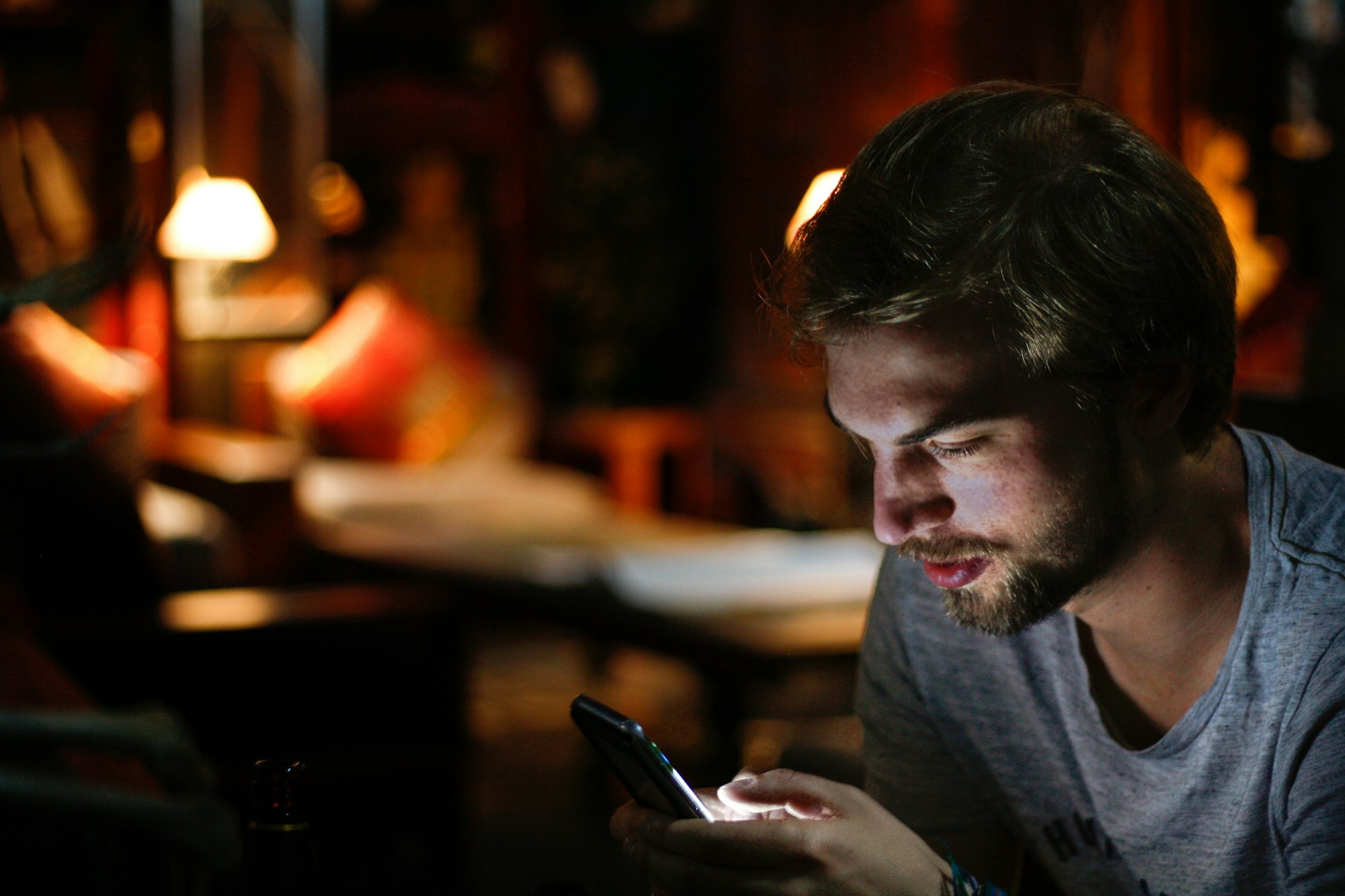 Person absorbed in an AI chat on their phone