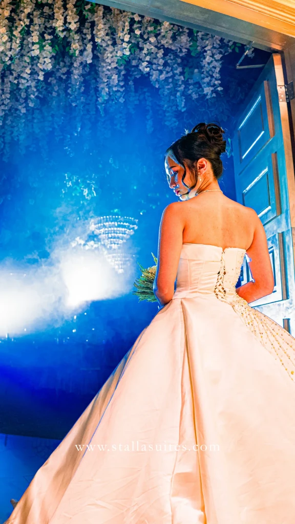 Bride gazing into the misty blue doorway before her grand entrance at Stalla Suites Events Place QC