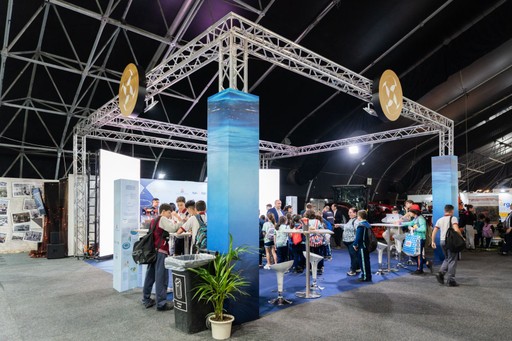 Woman in a beige turtleneck by an old computer and TV, retro 80s office portrait.