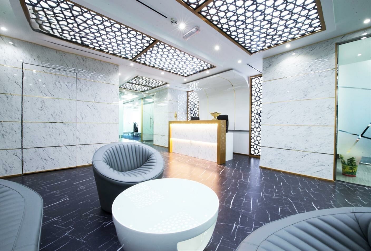 Aerial view of Dubai Metro and Sheikh Zayed Road traffic near luxury real estate.