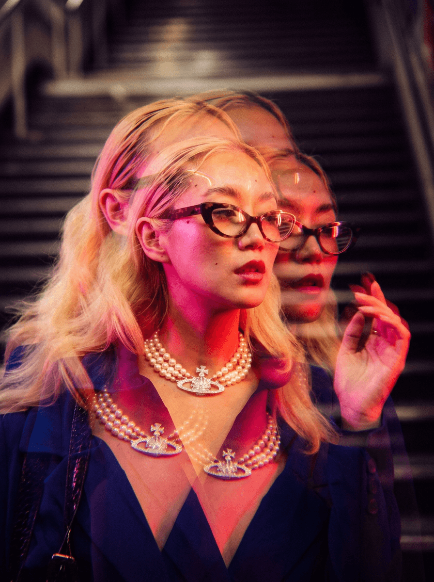 Shiba Inu dog jumping to catch falling autumn leaves