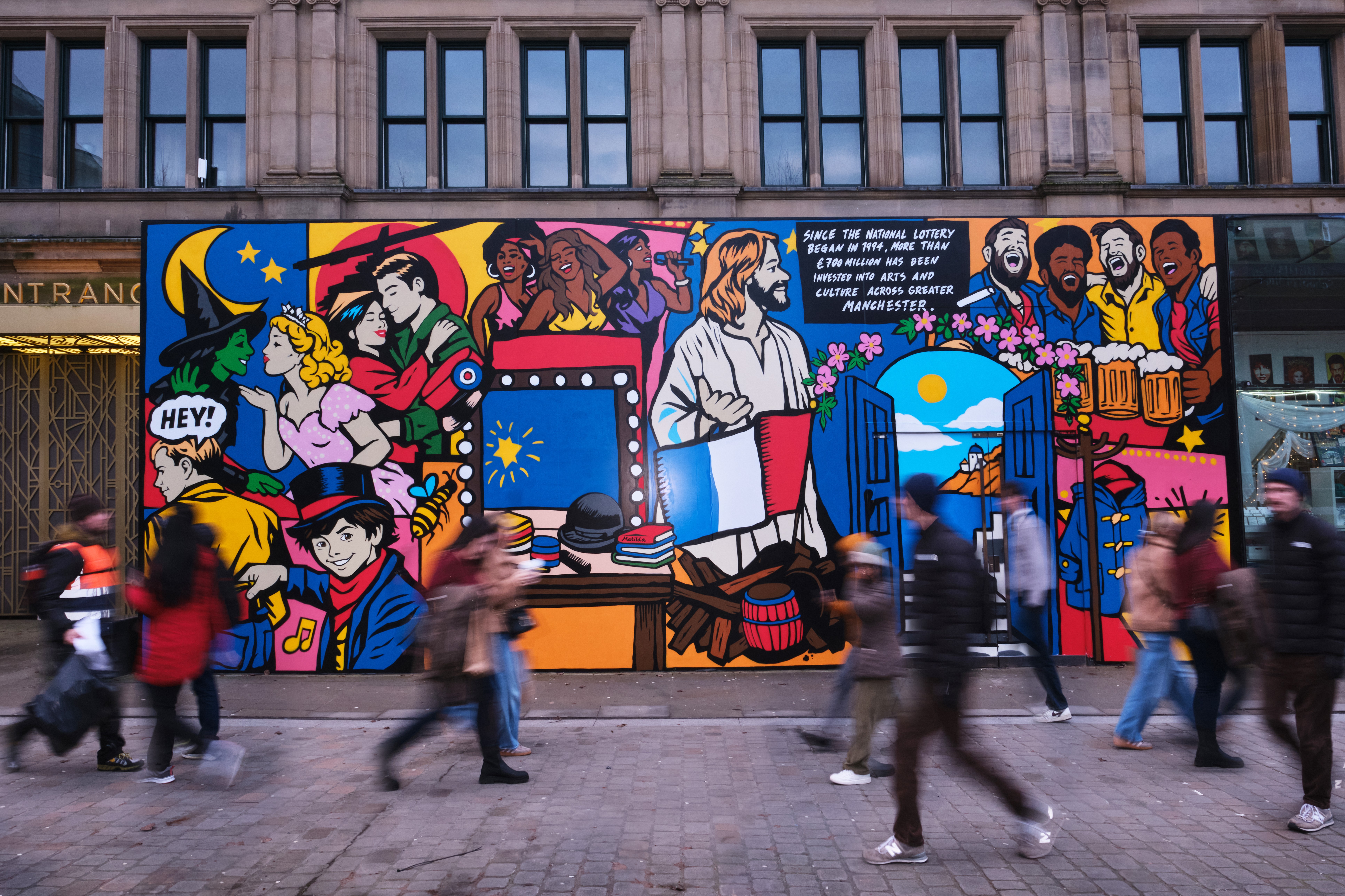Woman wears a blue coat in a blue environment.