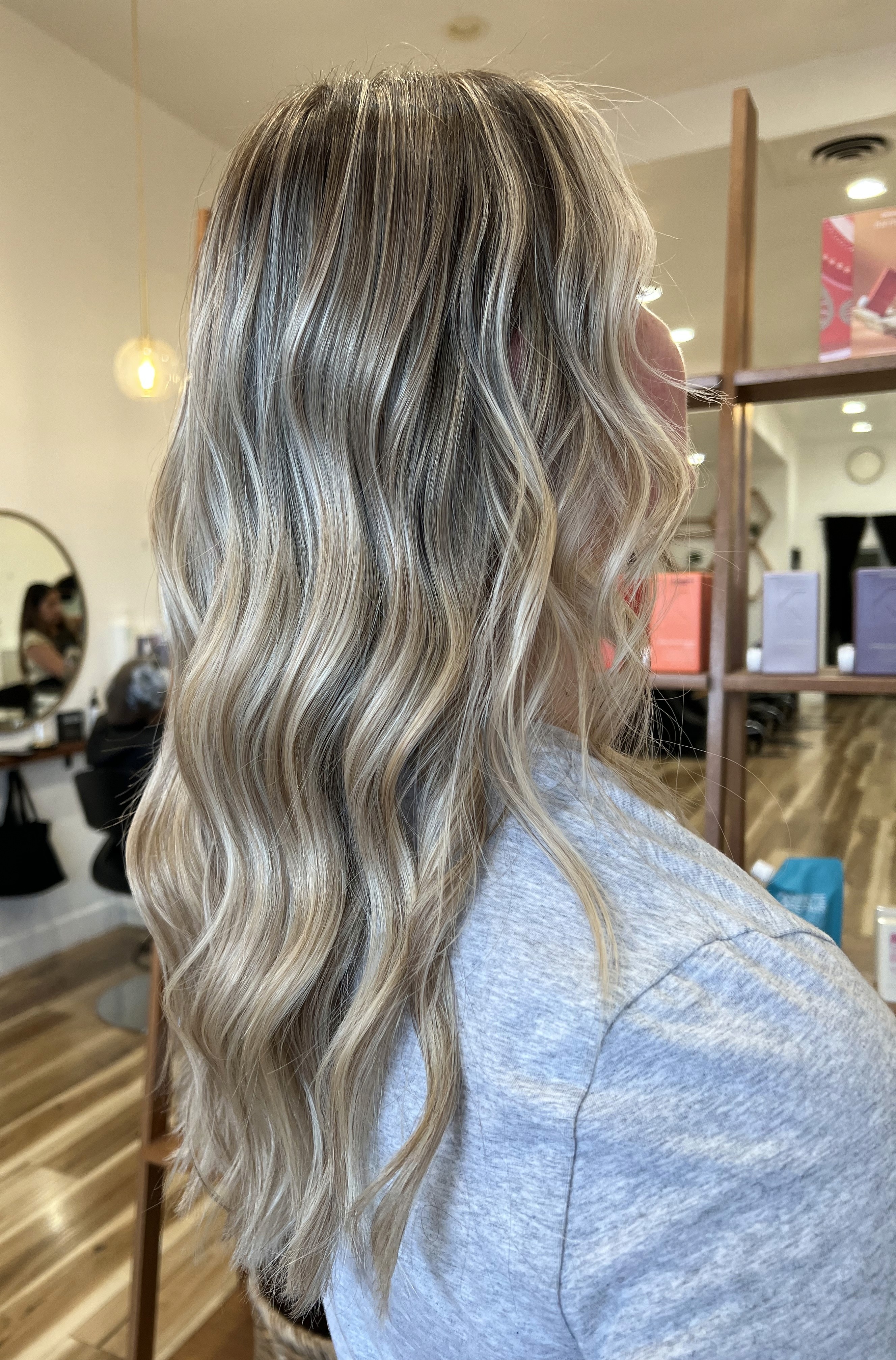 Lived-in blonde K-tip extensions by Adriana Jackson at Del Sol Hair Studio Huntington Beach