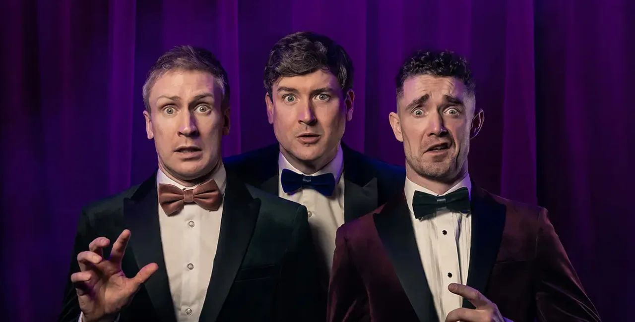 Three men in tuxedos with surprised expressions