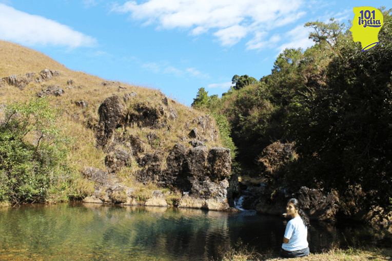 A cool, blue pool with running water