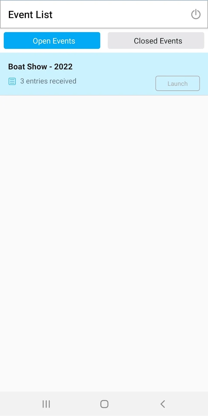 a hand holding a black device