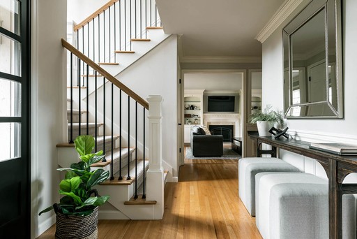 A remodeled entryway in Sammamish WA.  Newly designed and decorated stairwell with home organization. Interior Design in Seattle, Washington by Elegant Simplicity and interior designer Sherri Monte.