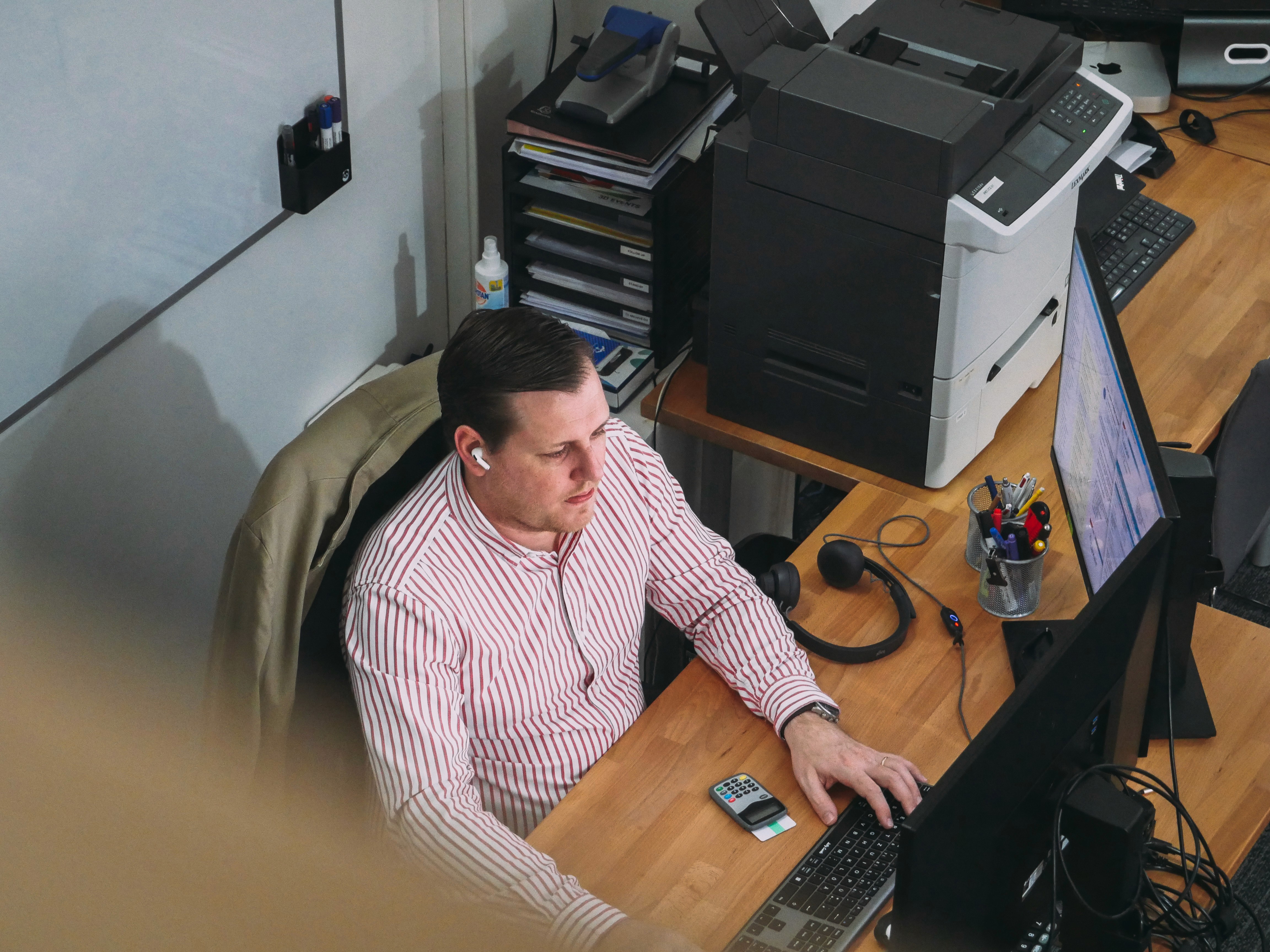 men sitting in front of their laptop computer