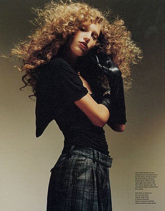 Woman in Teal Setting