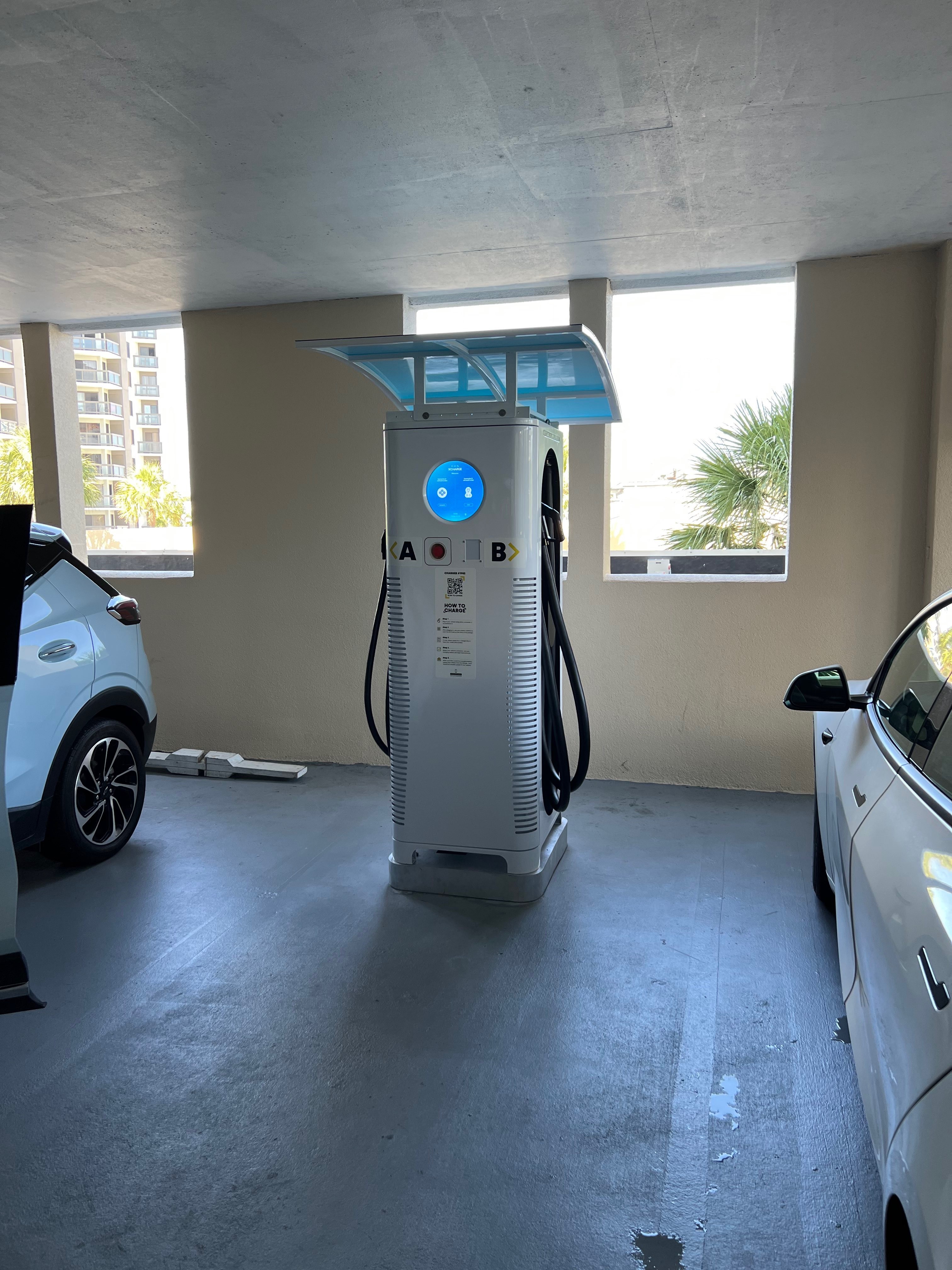 C6AM Charge with a blue hood in a parking garage with windows