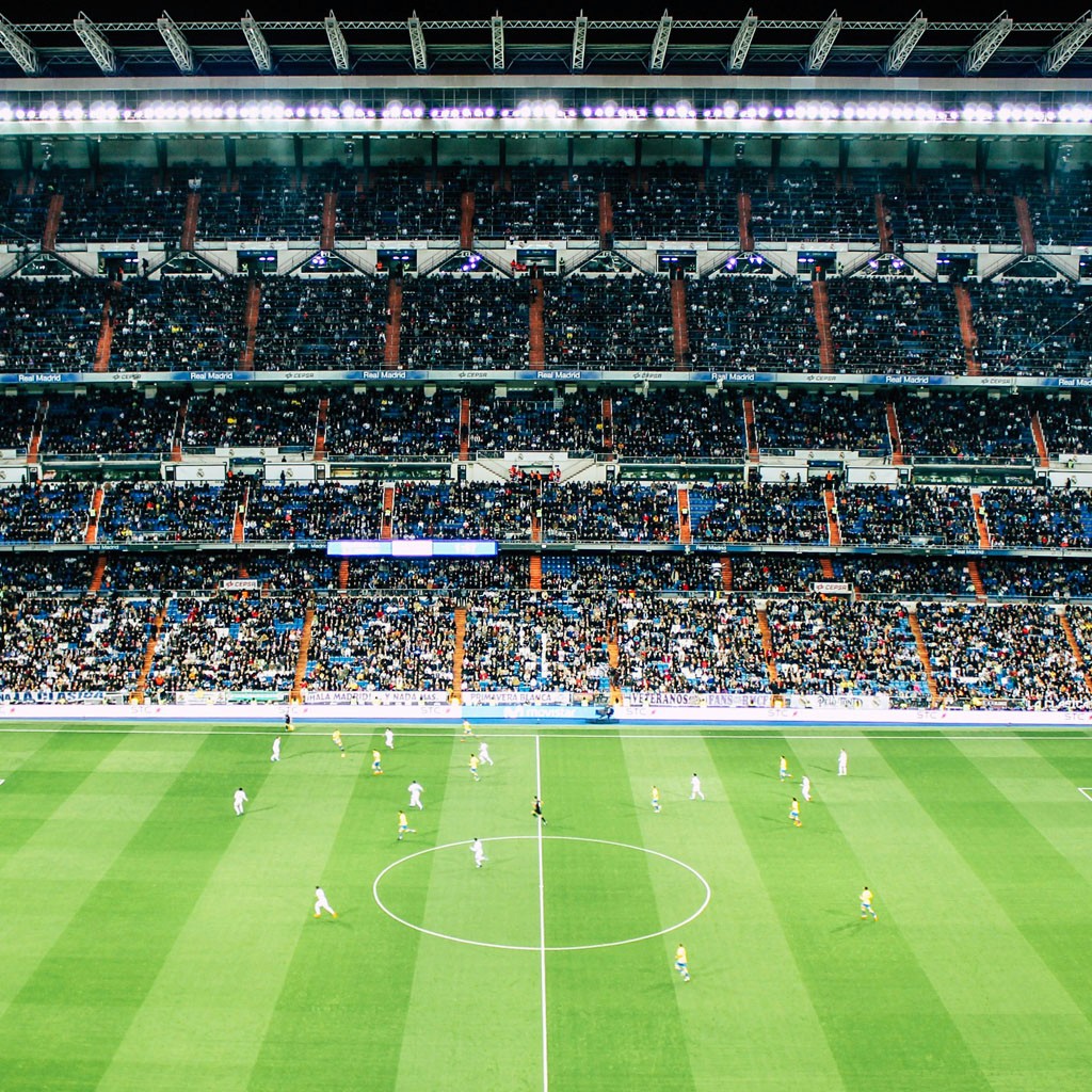 Full soccer stadium with thousands of fans attending a live sporting event.