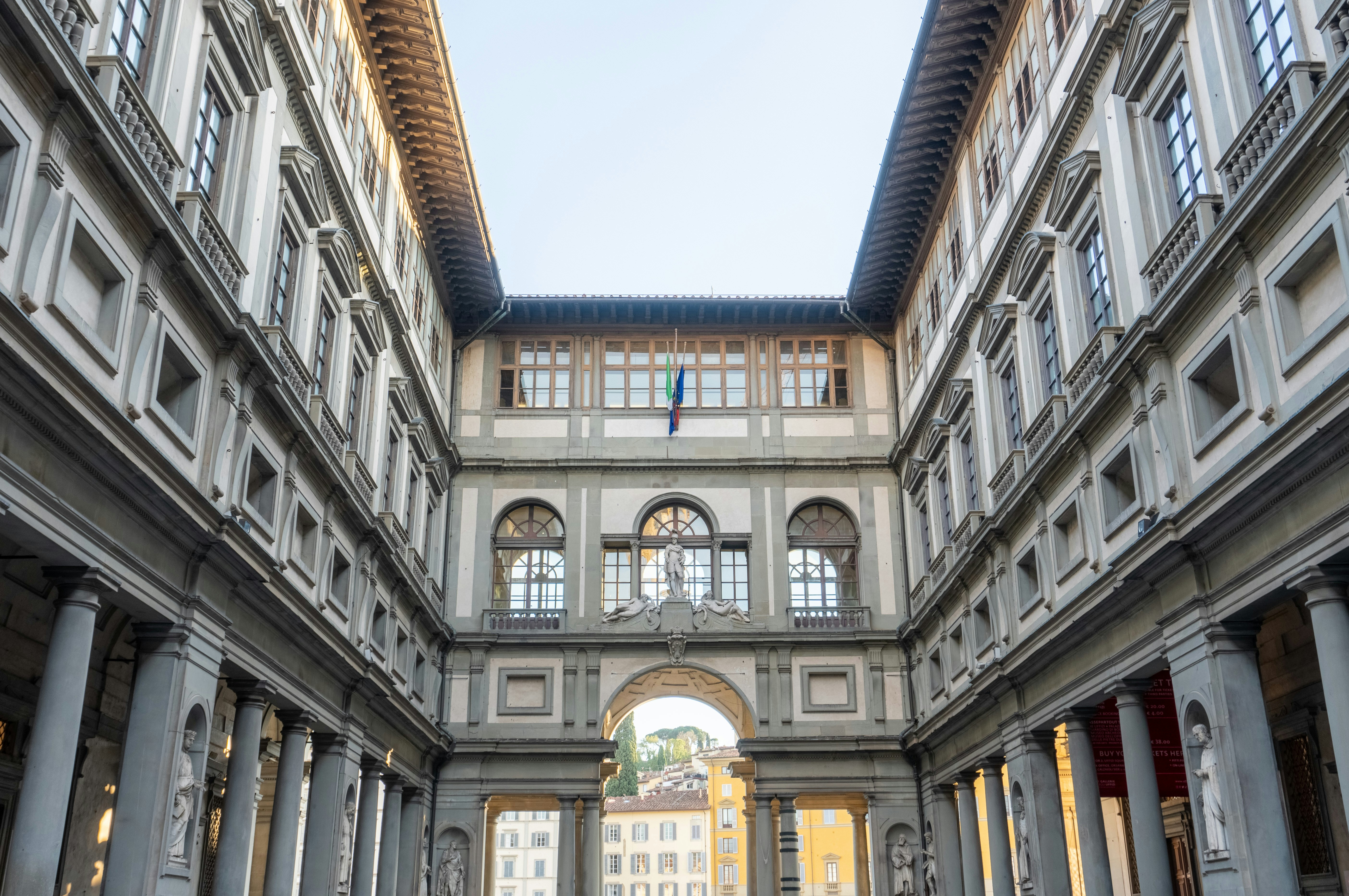 a large building with columns and arches