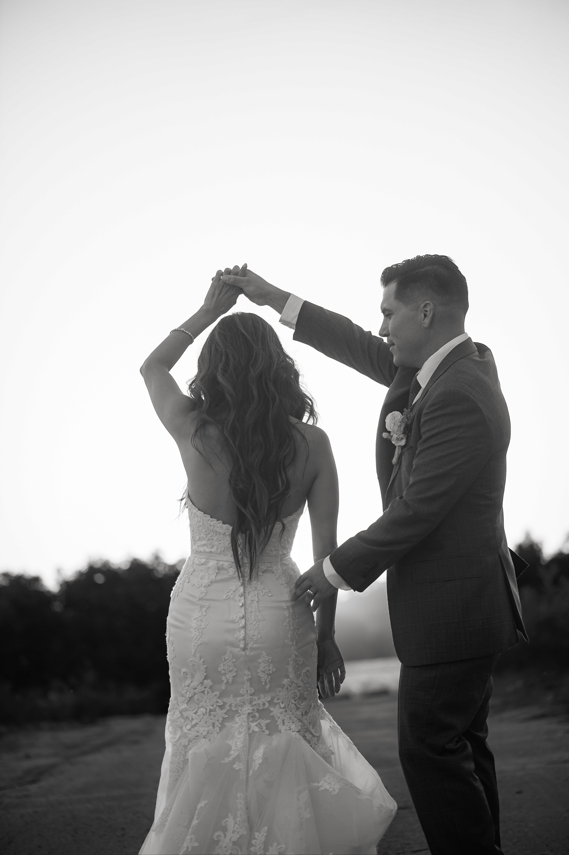 Flat lay wedding details with bouquet, rings, and sparkling bridal heels
