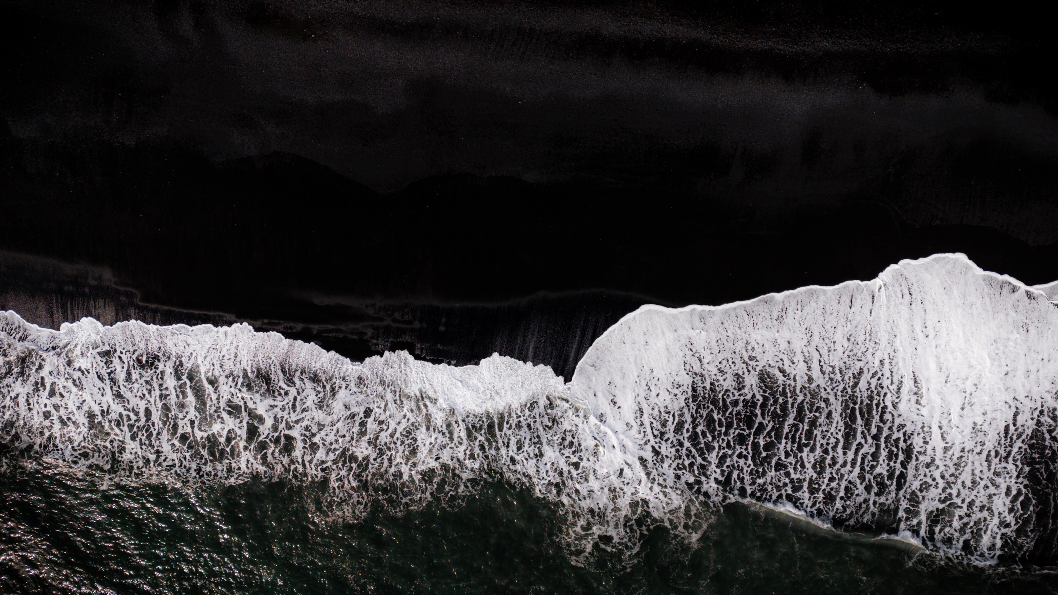 northern lights over snow-capped mountian