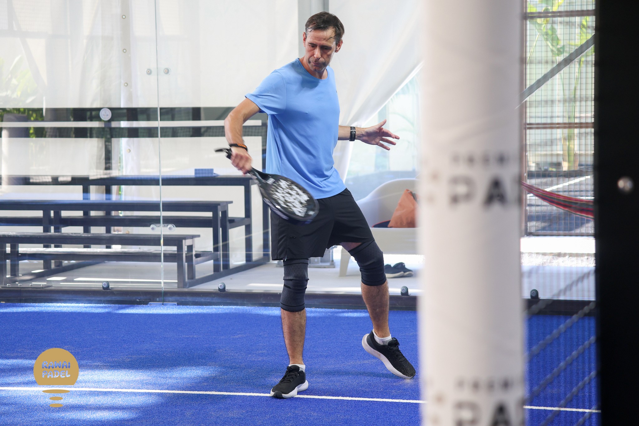 a tennis racket and ball on a court