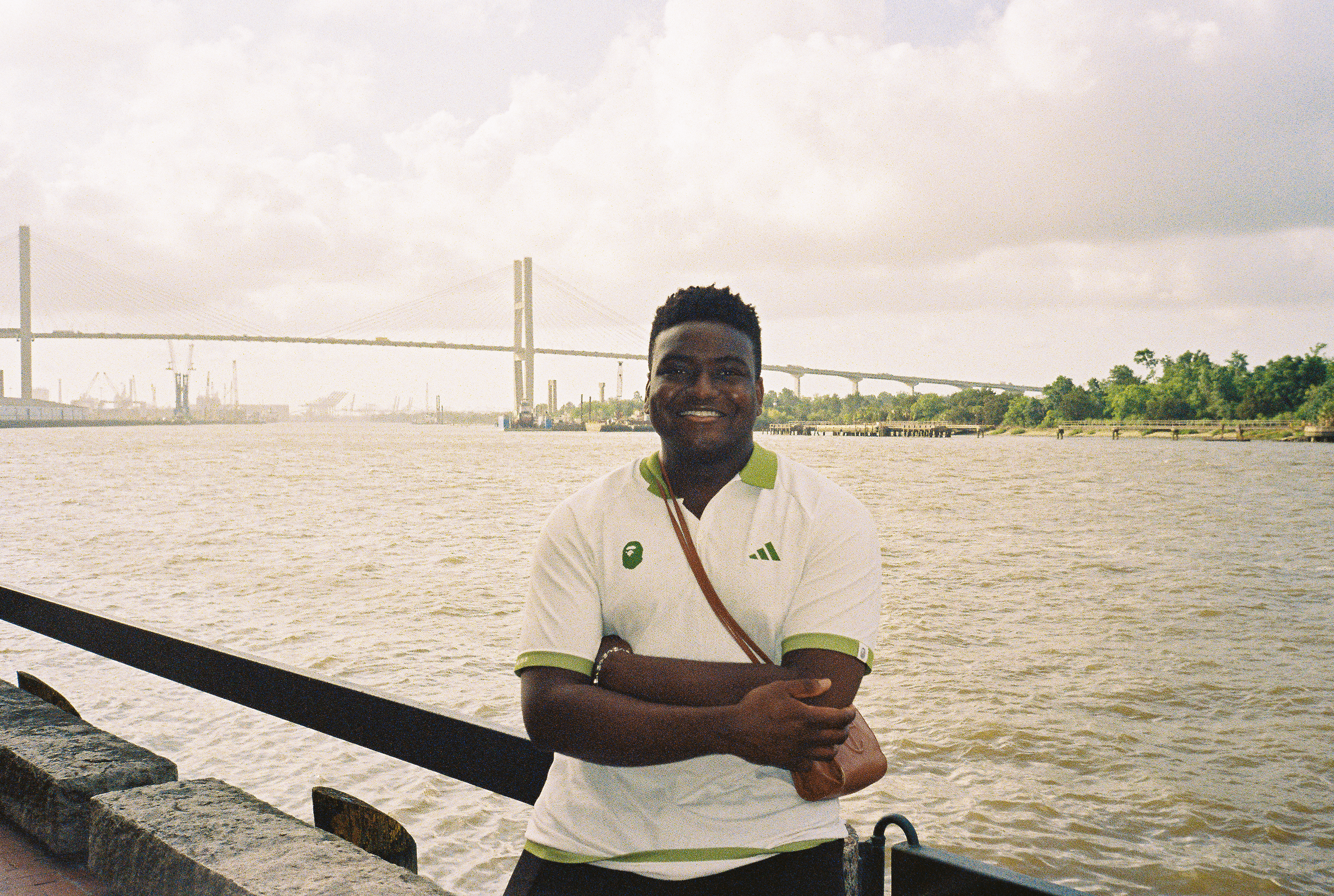 man filming on beach