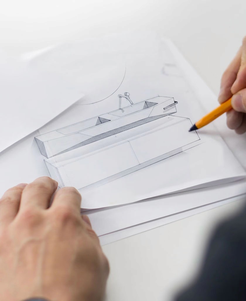 Modern glass and steel building with warm wooden ceilings, surrounded by lush greenery, blending contemporary architecture with nature.