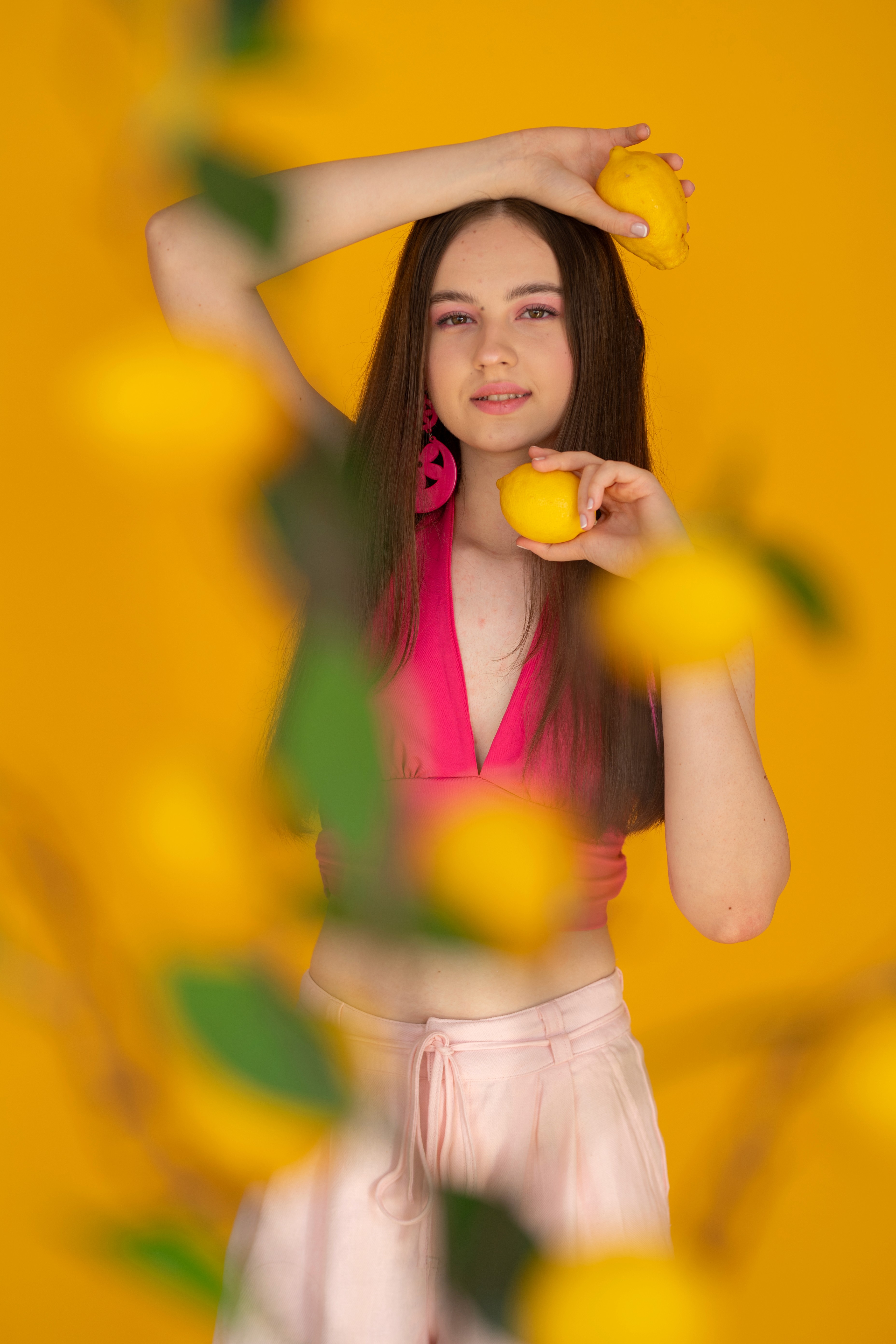woman wearing yellow long-sleeved dress under white clouds and blue sky during daytime