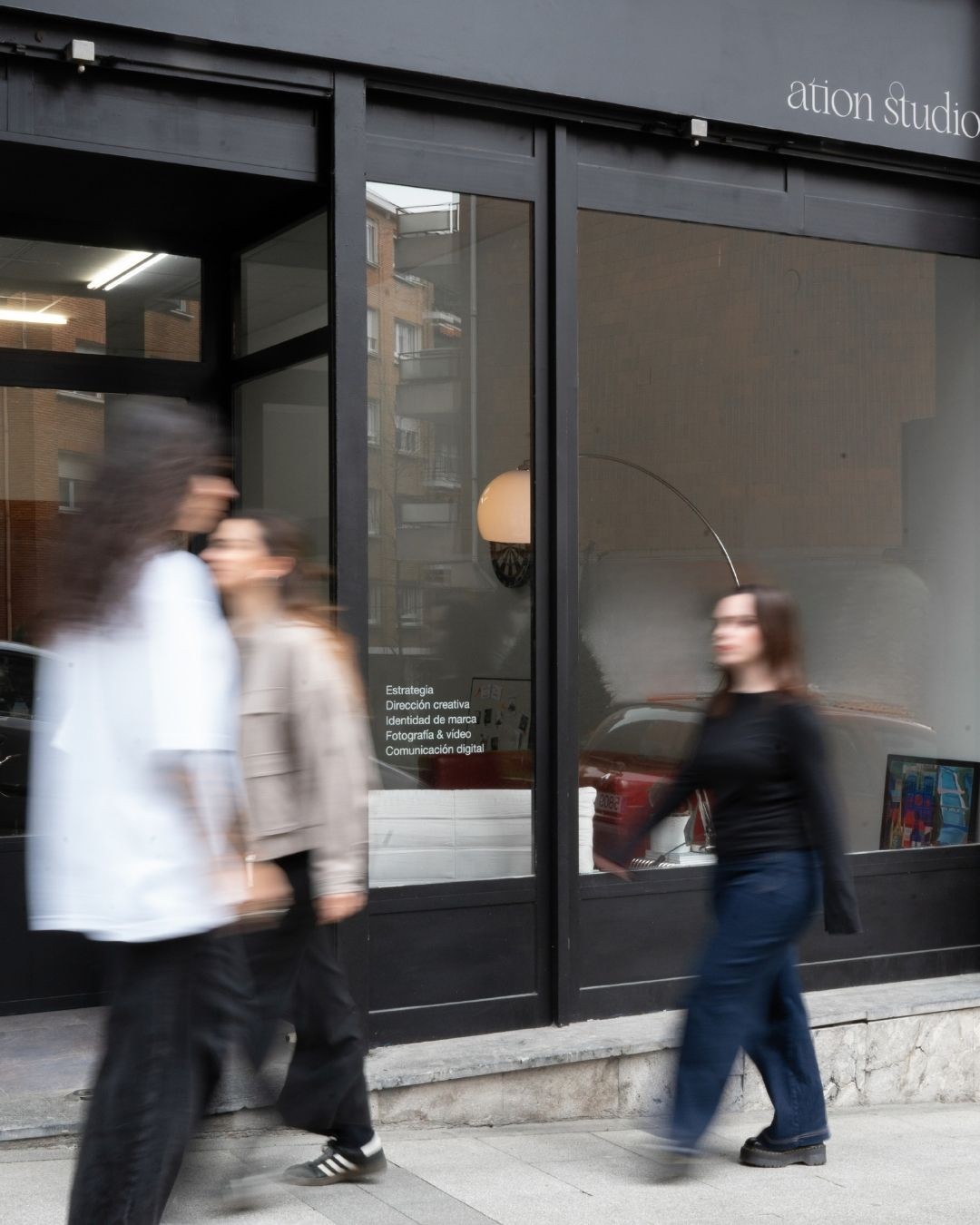 a blurry photo of a person standing in front of a wall