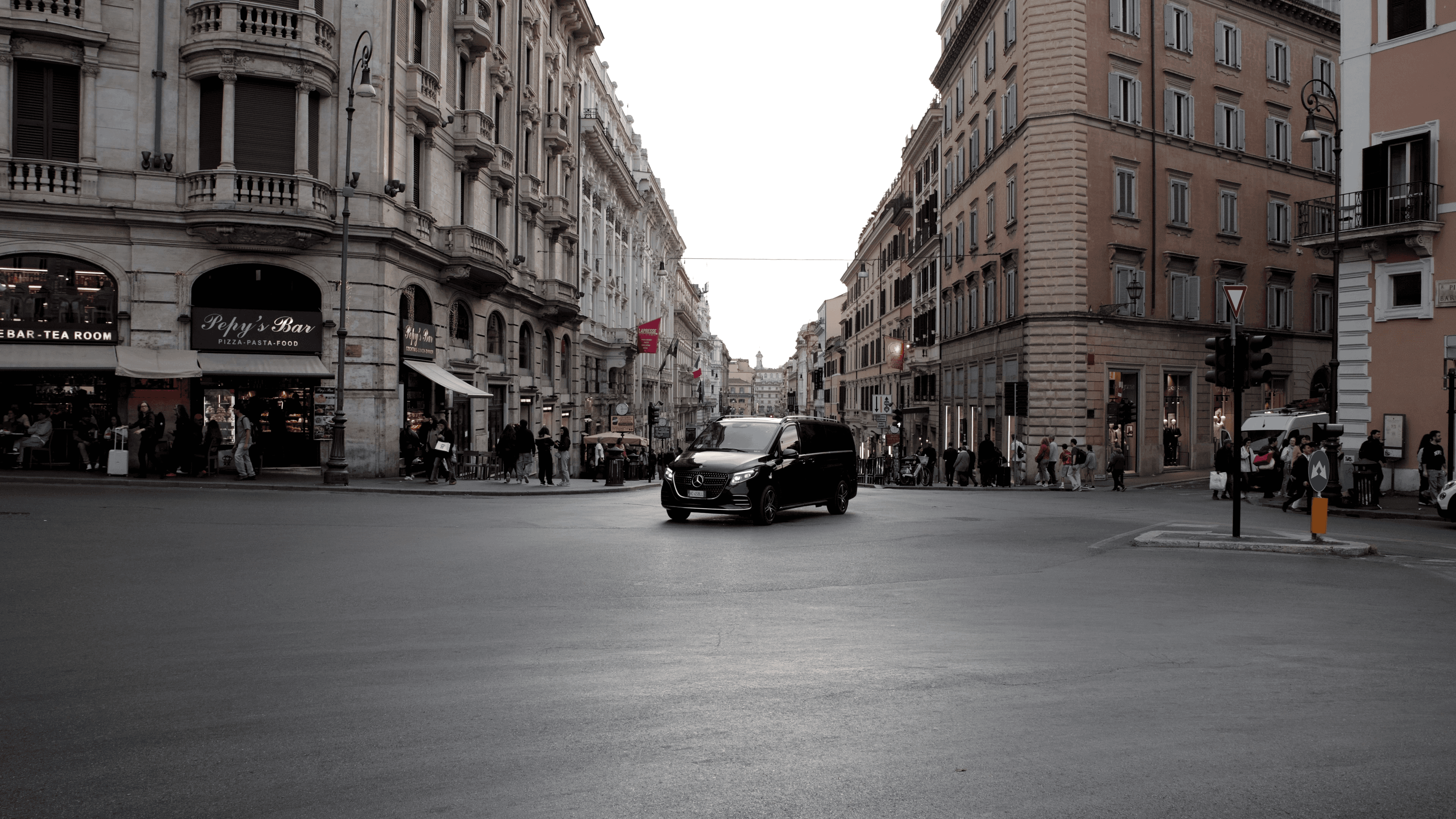 Mercedes V-Class van in the middle of a busy road in Italy