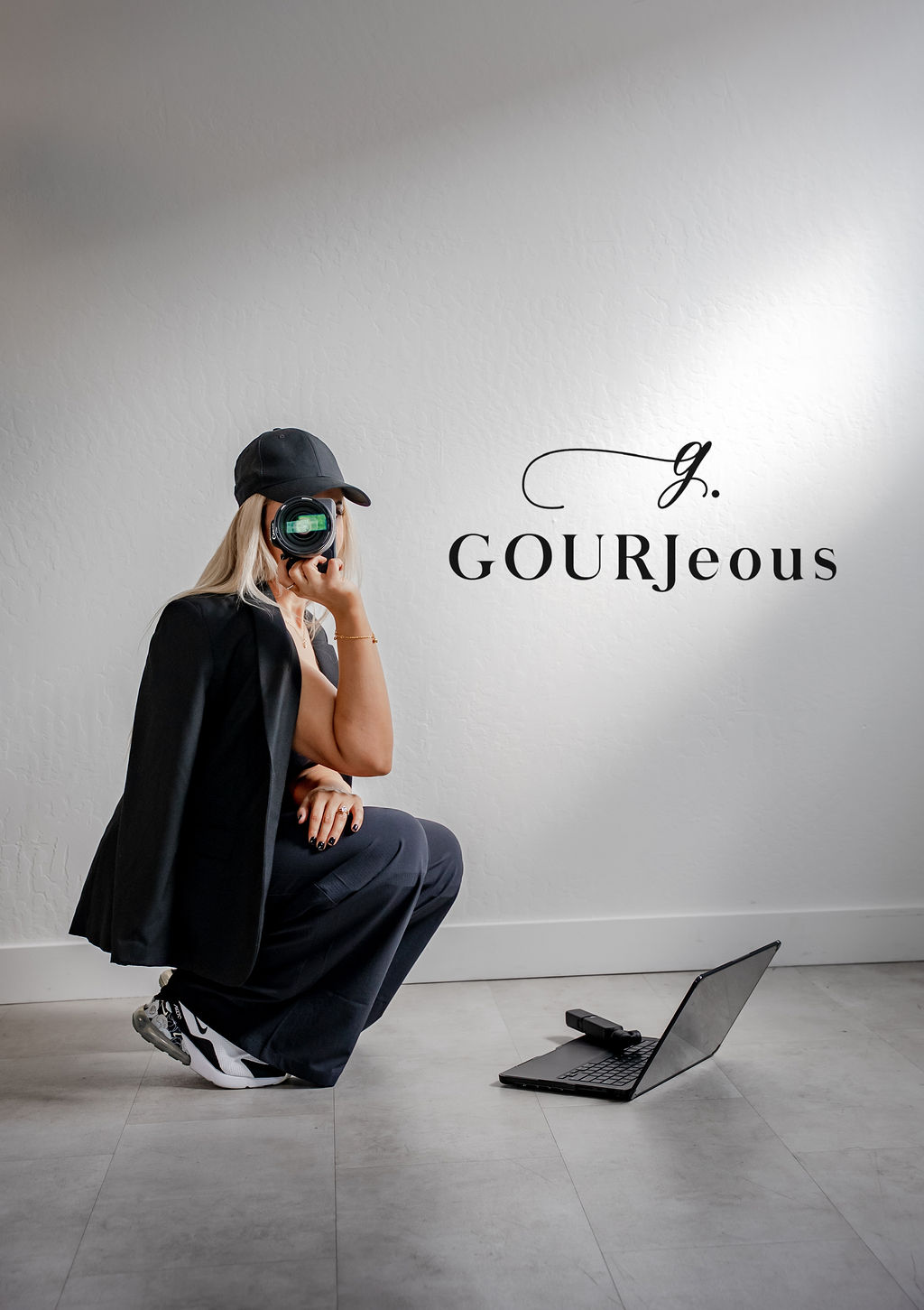 A couple stands outdoors at sunset.