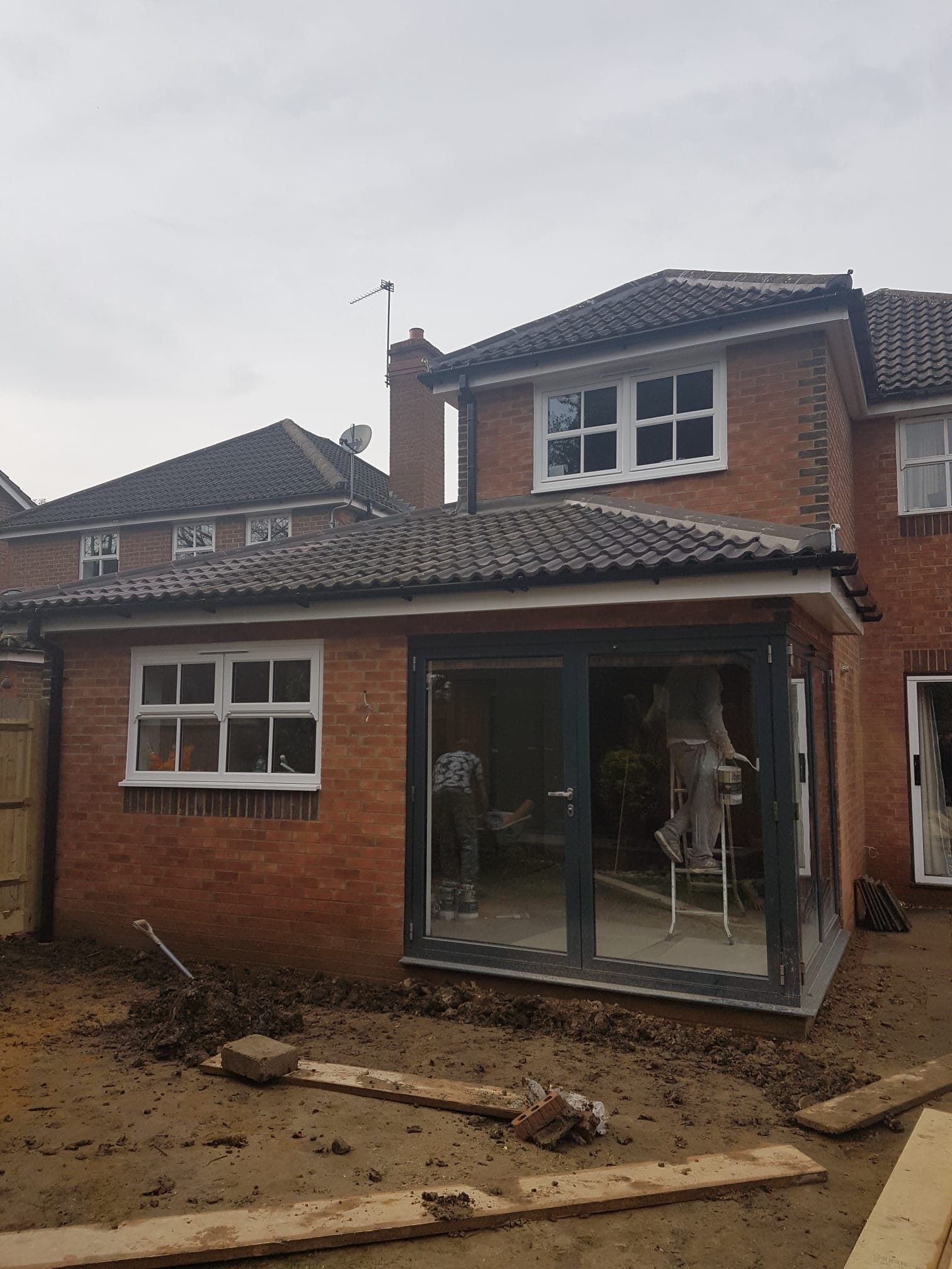 assorted-type carpentry tools on brown surface